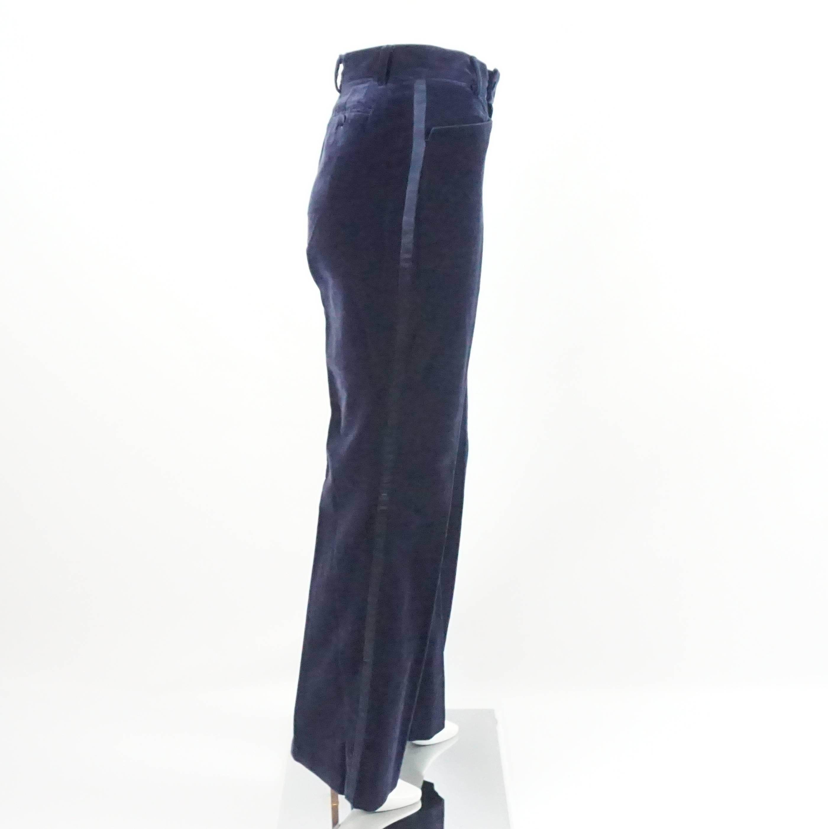 Gucci Navy Velvet High Waisted Pants with Silk Sides - 42 - 1990's. These vintage pants are back in style. They have a flare leg with silk stripes down both sides, 2 front pockets,and 2 back pockets. The pants are in good condition with light wear