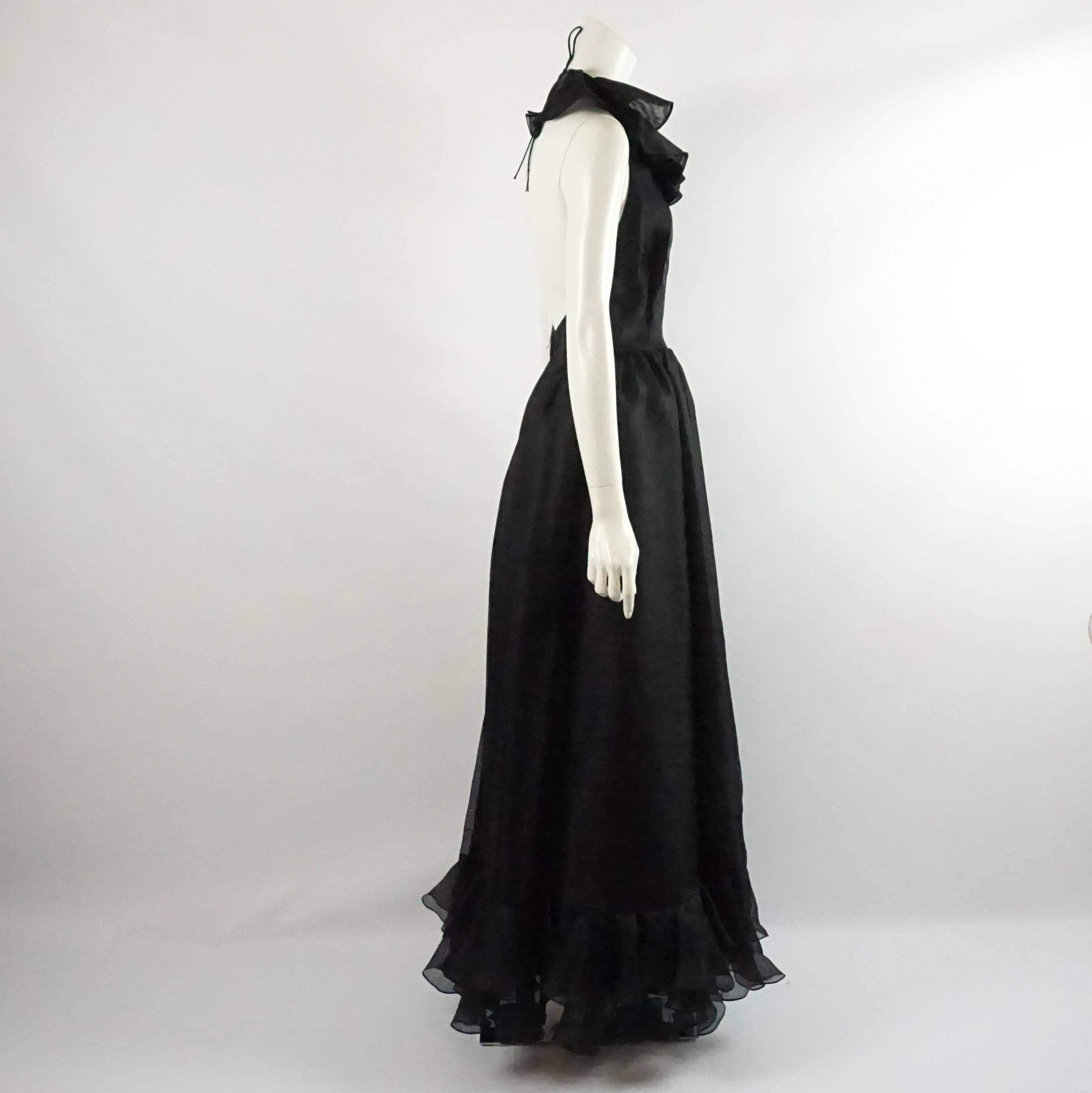 Oscar de la Renta Black Linen Halter Gown with Ruffles - 10 - 1990's . This gown is truly spectacular and can be worn black tie or cocktail because of its casual fabric. It features a fitted bodice with a delicate skirt flowing down to two bottom