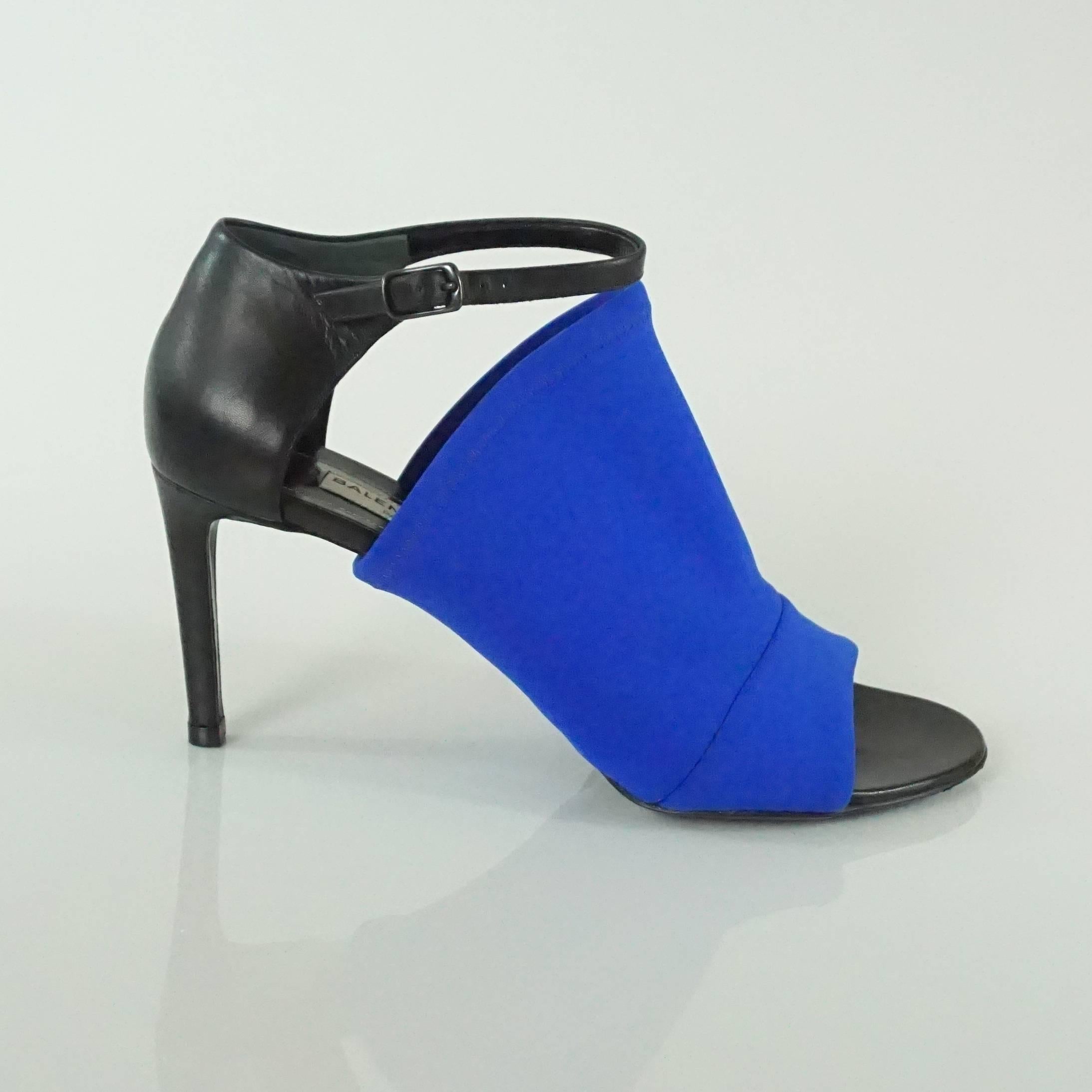 Balenciaga Black & Electric Blue Neoprene Glove Sandal - 36.5. These shoes are new and come with a duster and box. They have an open toe with an ankle strap and are the perfect pop of color.

Heel Height: 3