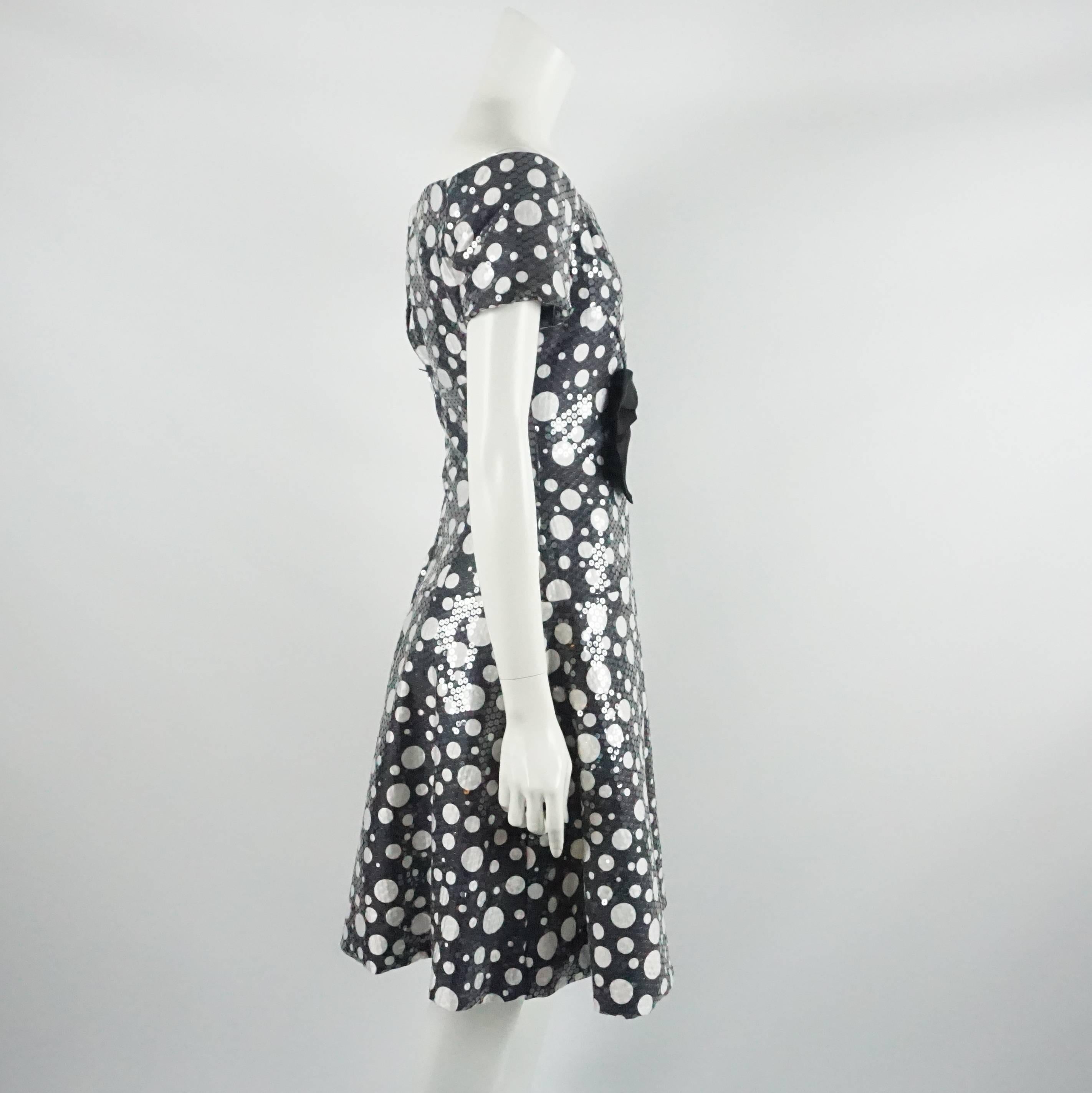 Scaasi Black and White Polka Dot Sequin Dress - S - 1980's. This Scaasi black and white polka dot dress is short sleeved and has clear sequins on the entirety of the fabric. The dress also has a boat neck line black bra on the inside, a large front