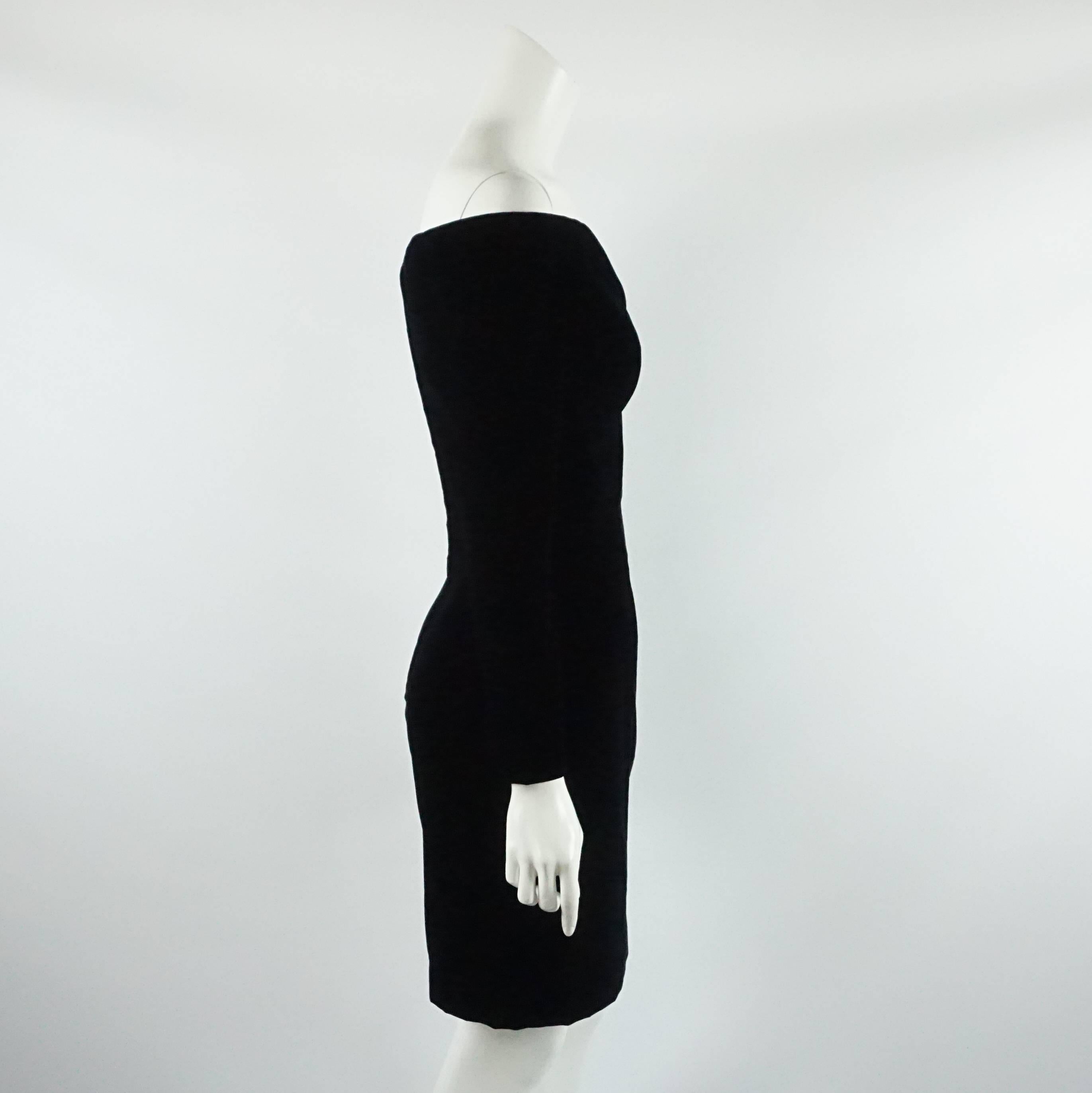 This Vicky Tiel black velvet off the shoulder long sleeve dress  has boning on the bodice and a small slit near the bust. The dress is vintage from the 1980's and is excellent condition with light wear to the velvet.

Measurements
Bust: