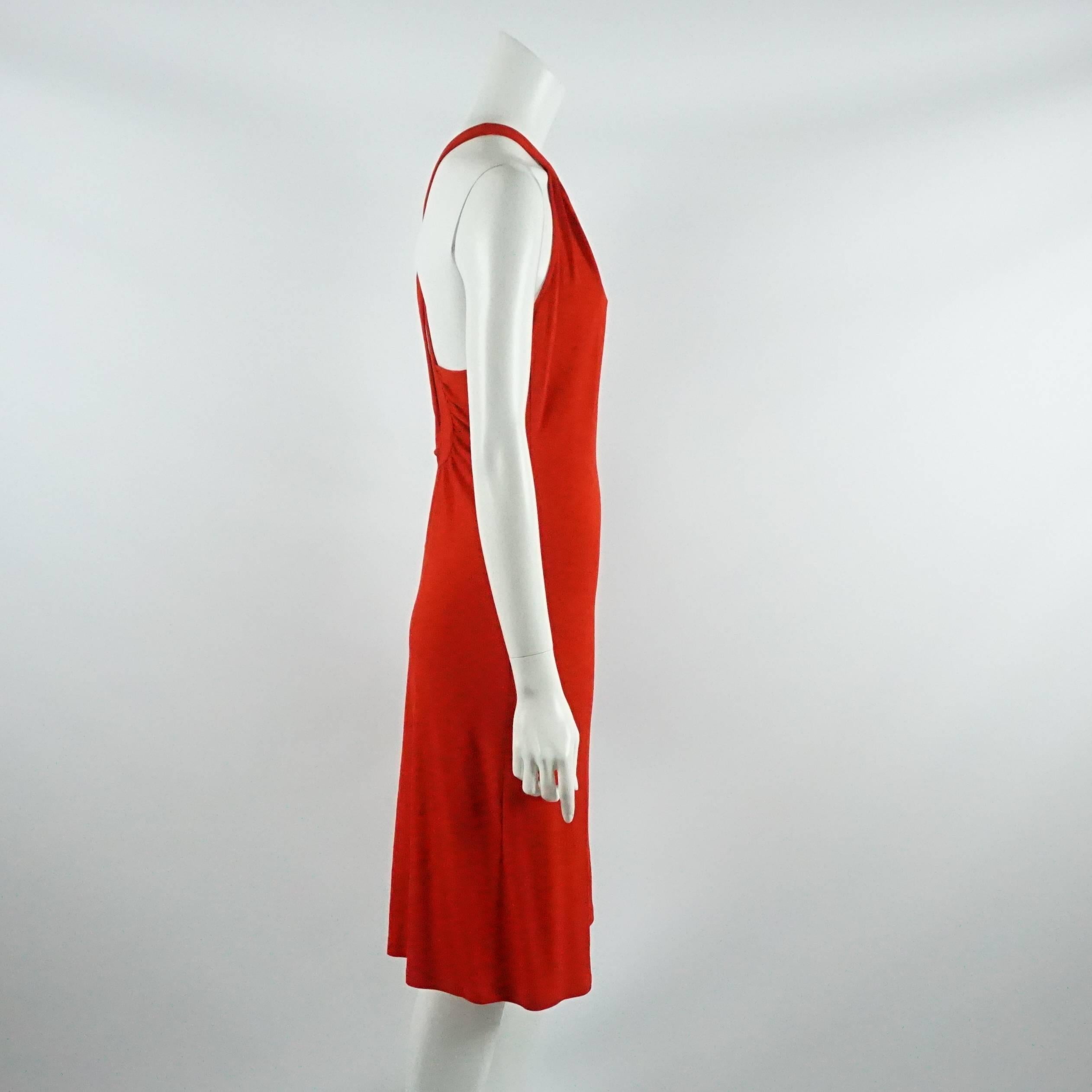This Celine halter dress is a beautiful shade of red. The straps criss-cross in the back to form a keyhole cutout. This dress is in very good condition with a couple minor pulls.

Measurements
Bust: 36
