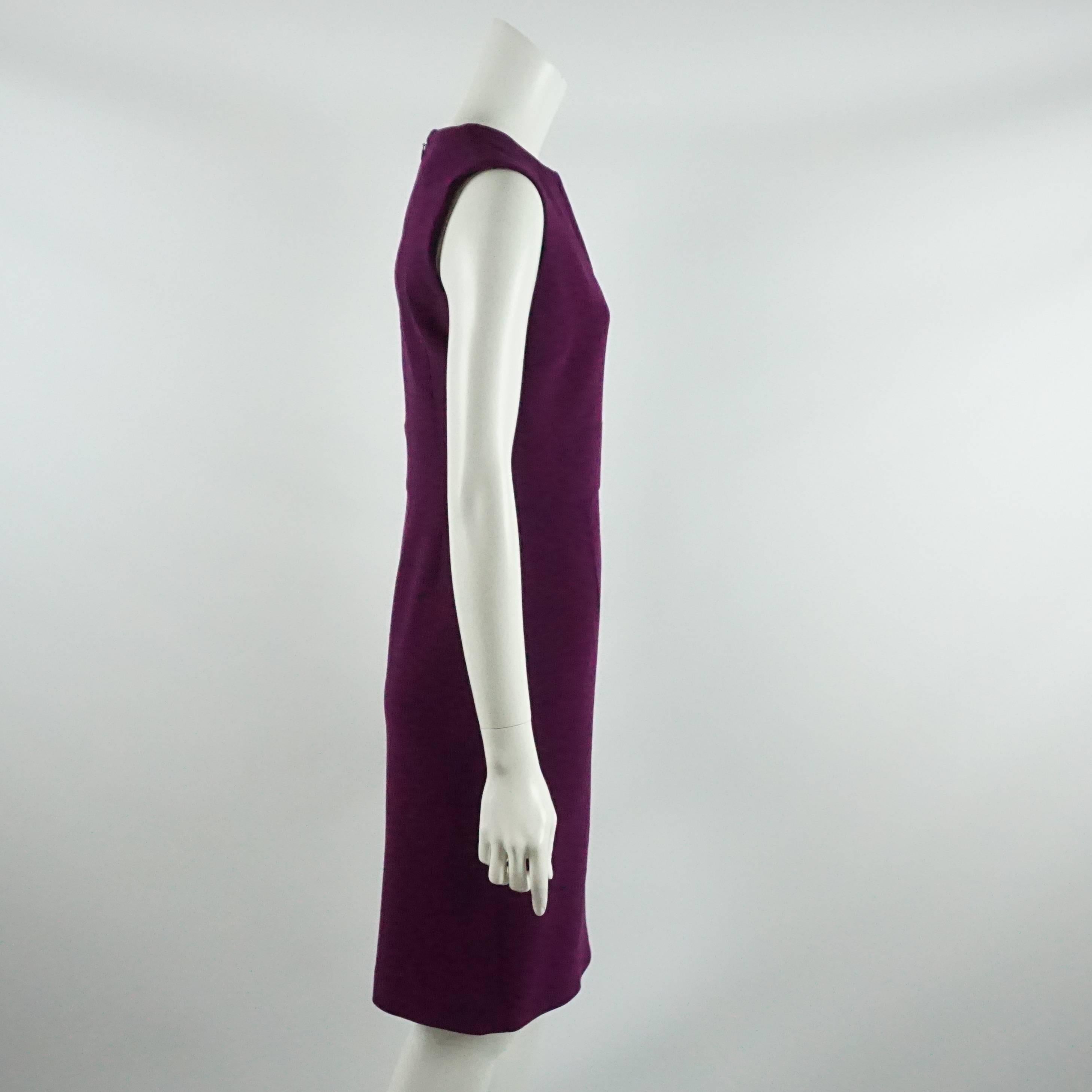 This Agnona dress is purple wool and features a v-neck. It is tapered at the waist and, on the back, has a slight pleat and a slit. This dress is in excellent condition.

Measurements
Bust: 36