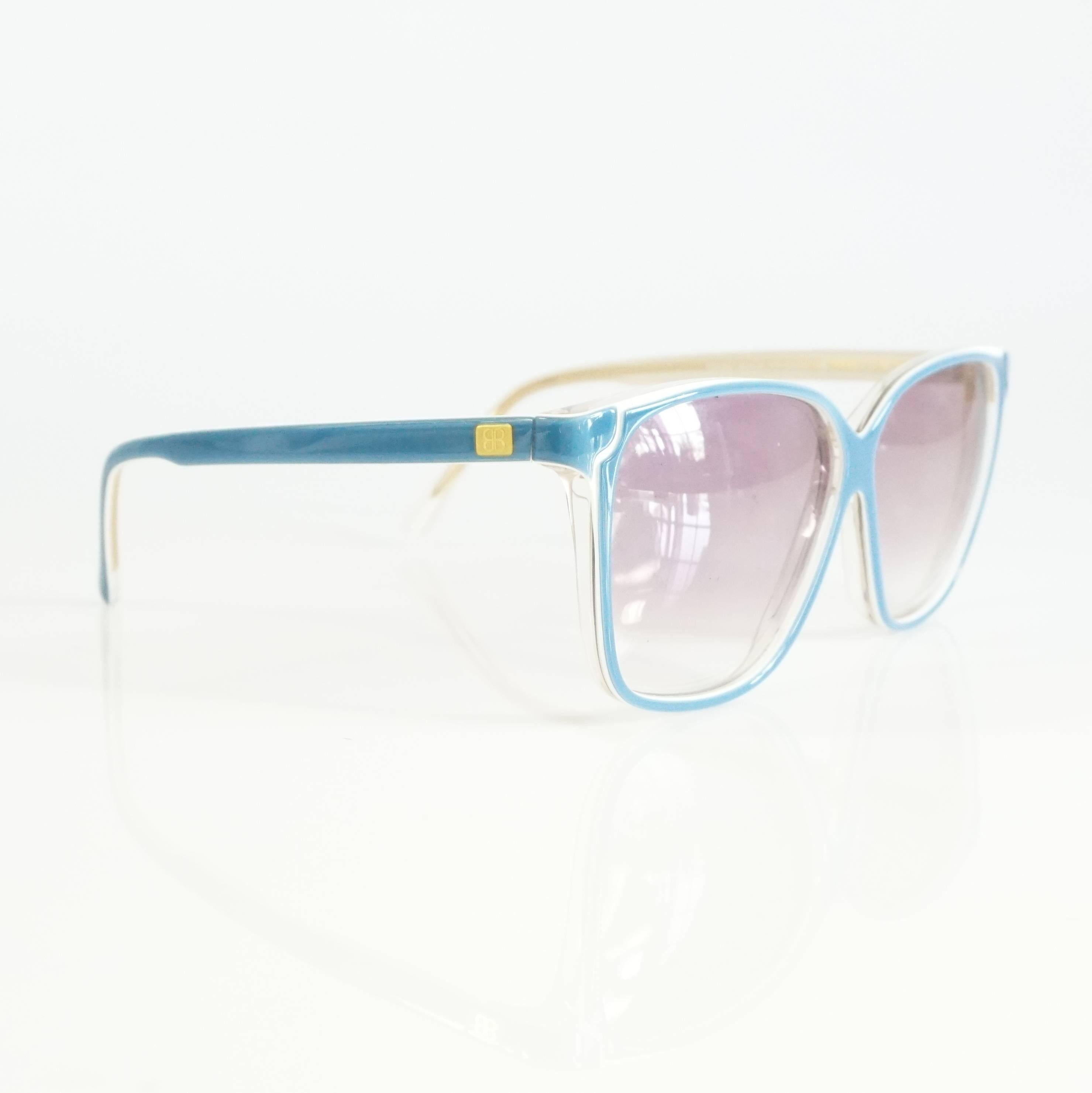 These vintage Balenciaga sunglasses have a blue and white square frame. These are in excellent condition. Circa 1980's. 

Measurements
Leg Length: 4.75"
Length (lens to lens): 5.5"
Lens Height: 2"
Lens Width: 2.5"