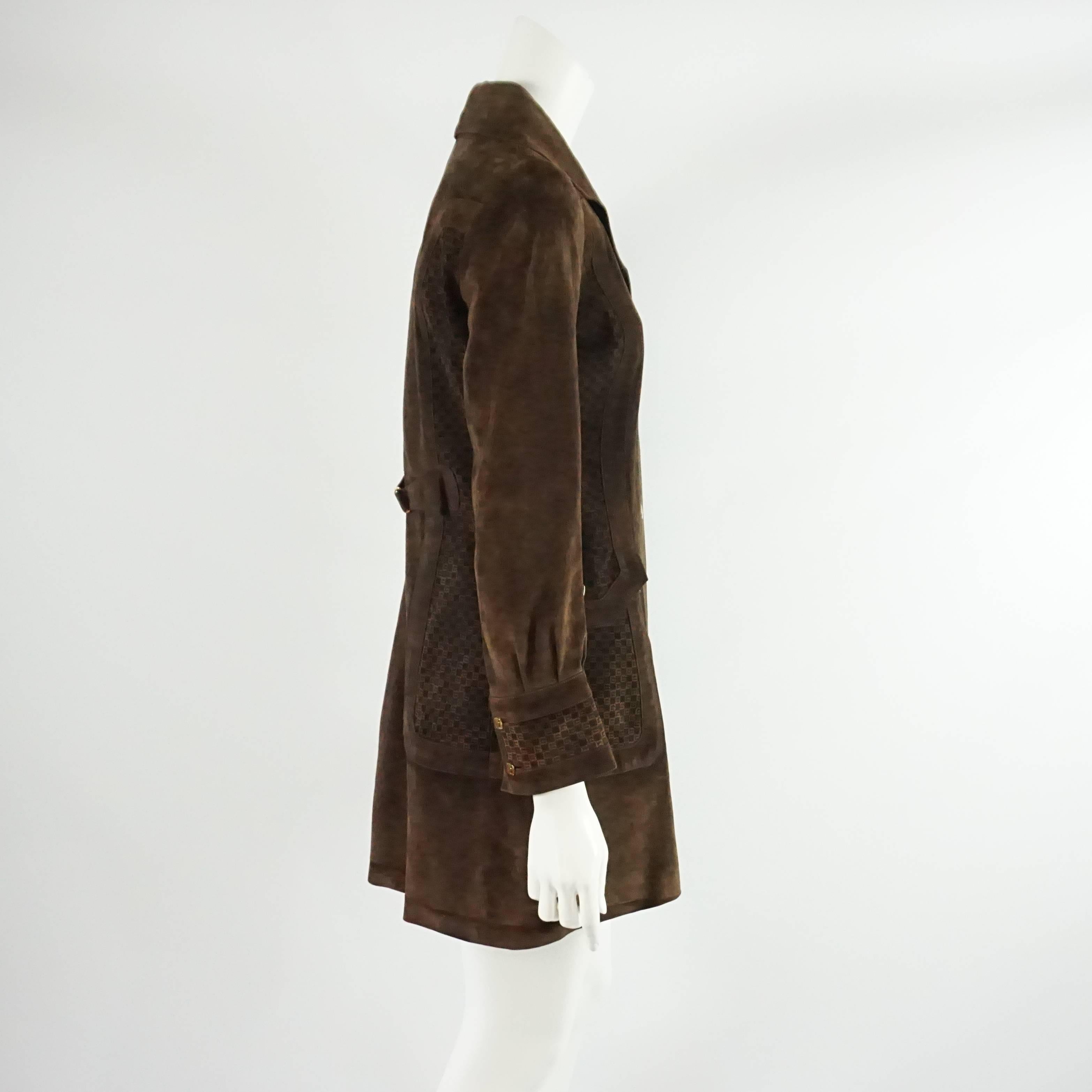 This Gucci jacket is a brown suede with monogram 