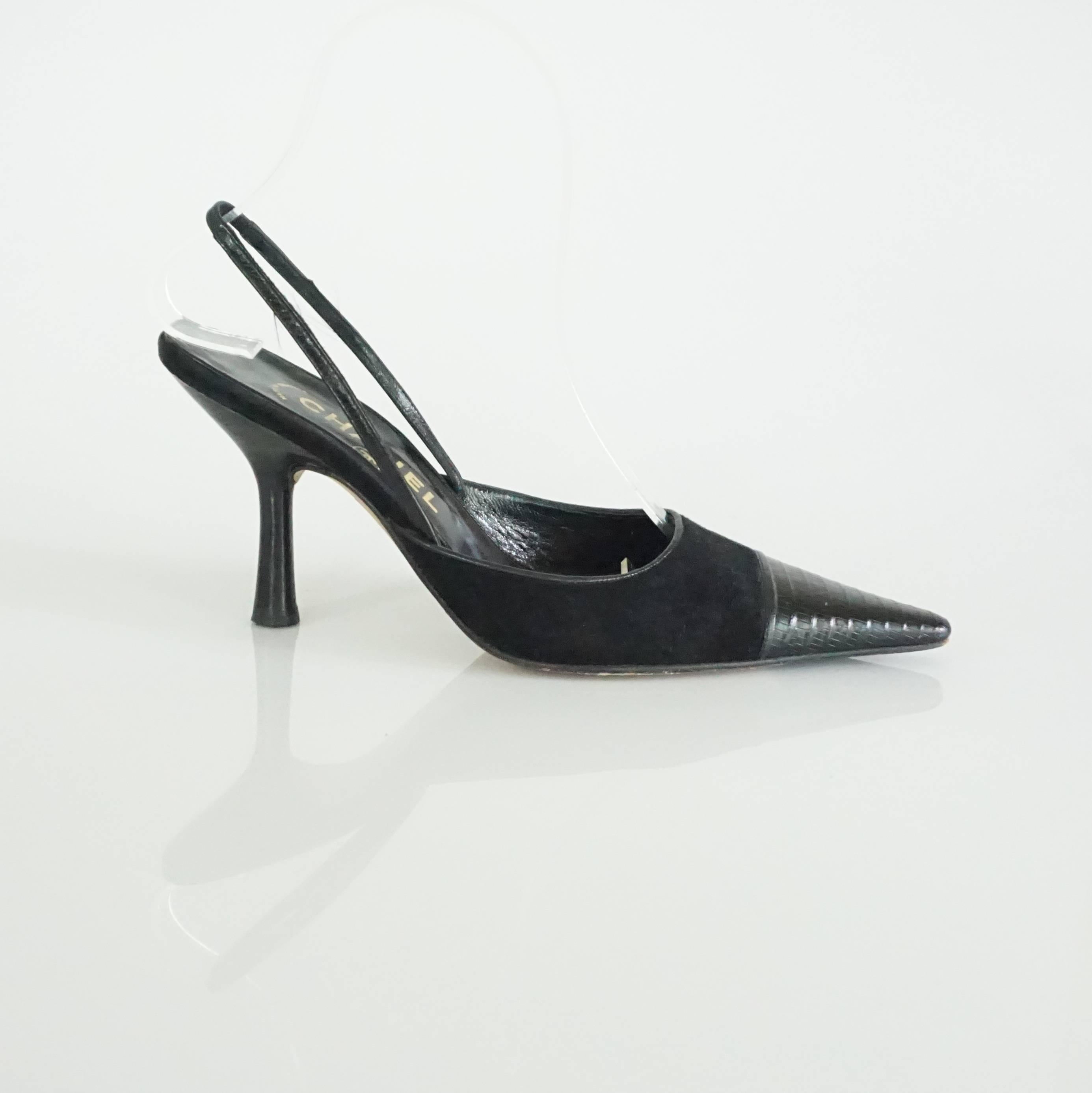 These Chanel black suede slingback heels have a lizard toe. They have a sleek look and are in excellent condition with very minor wear on the back of the heels as shown in the images. Size 37. 

Heel Height: approx 3