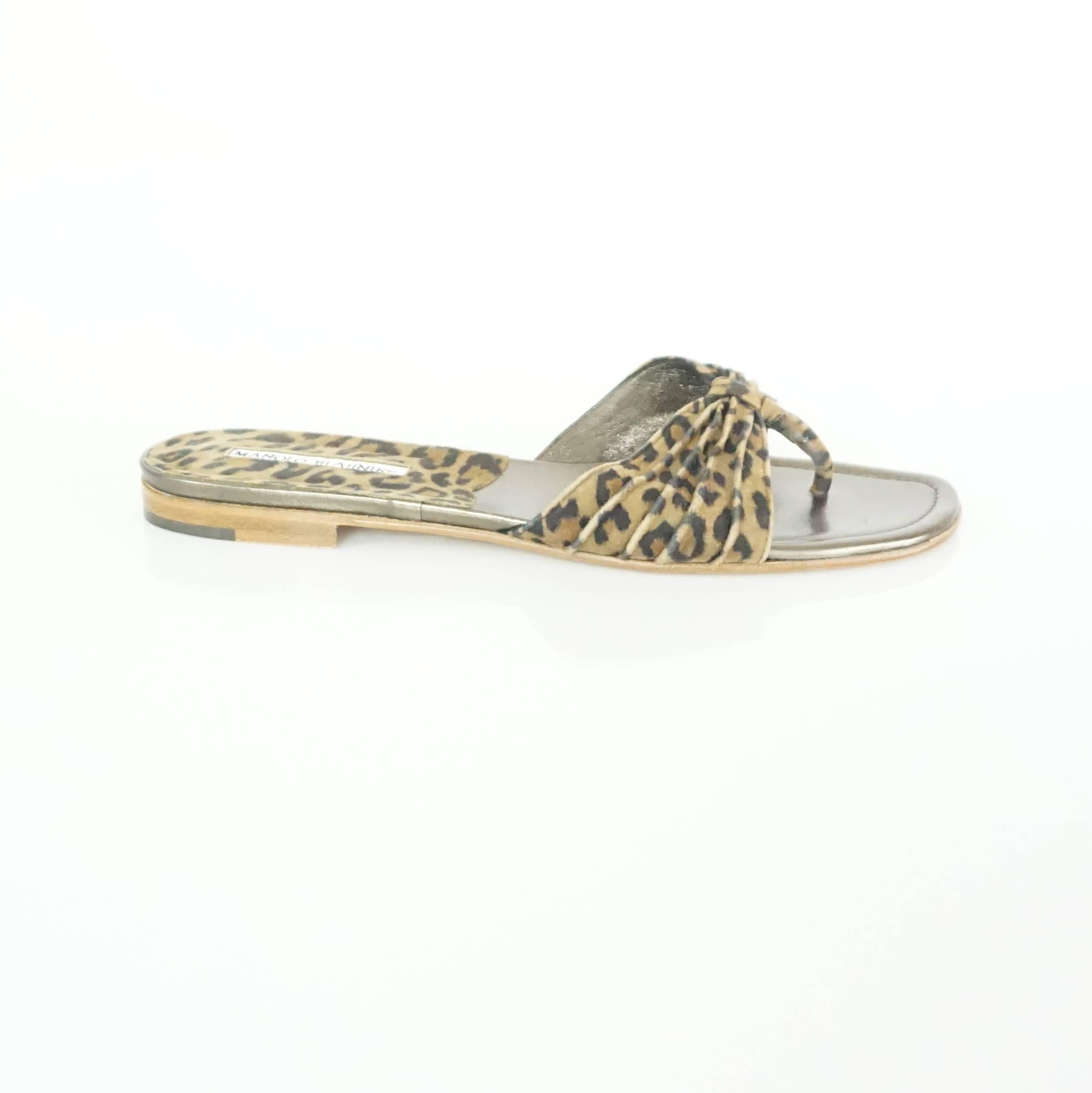 These Blahnik sandals are suede and feature an animal print. They are in excellent, like new, condition.