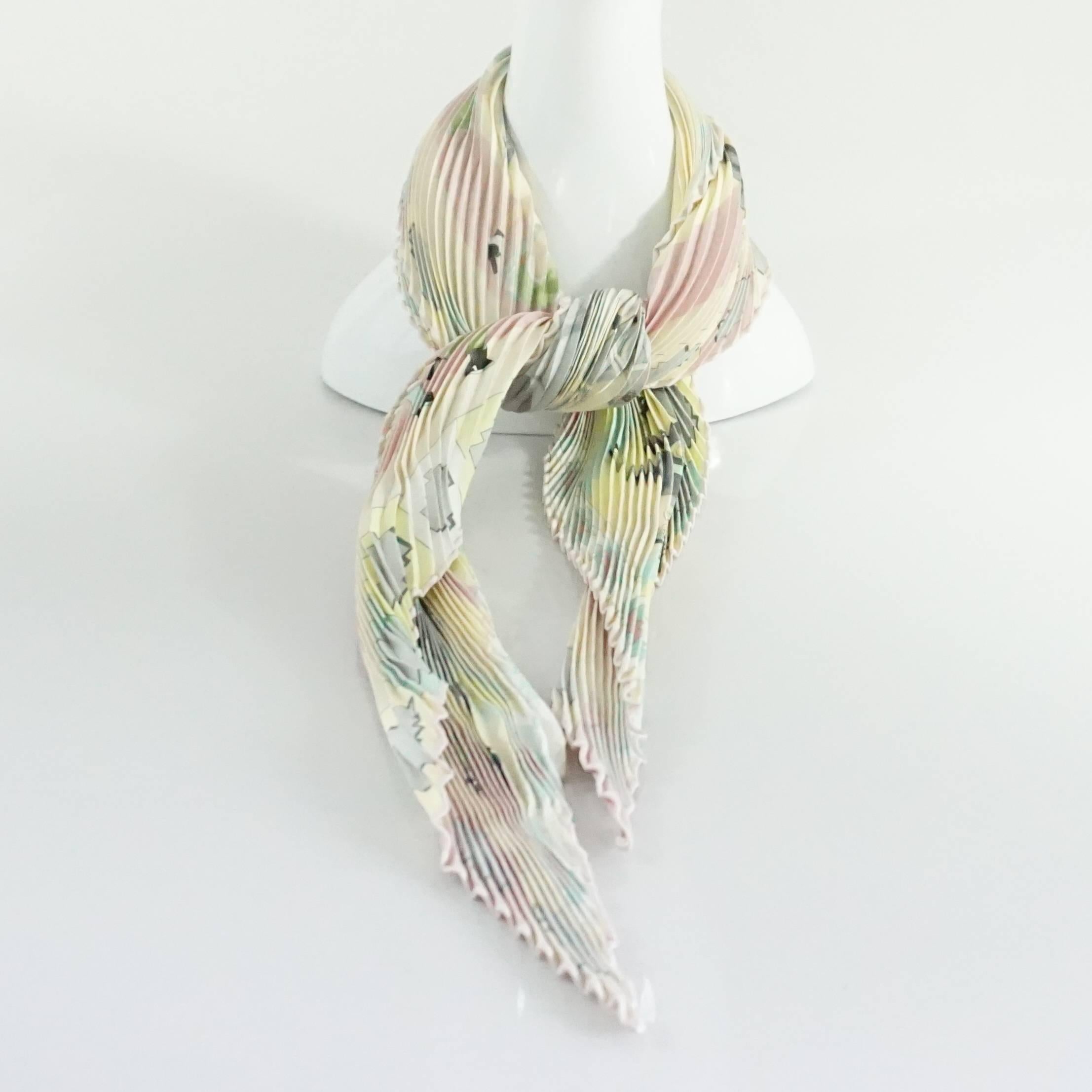 This Hermes pleated silk scarf has a beautiful polo scene on it. It is made of pastel colors and gray horses. This scarf is in excellent condition.

Measurements
Length (when closed):
Width (when closed):
Length (open):
Width (open):