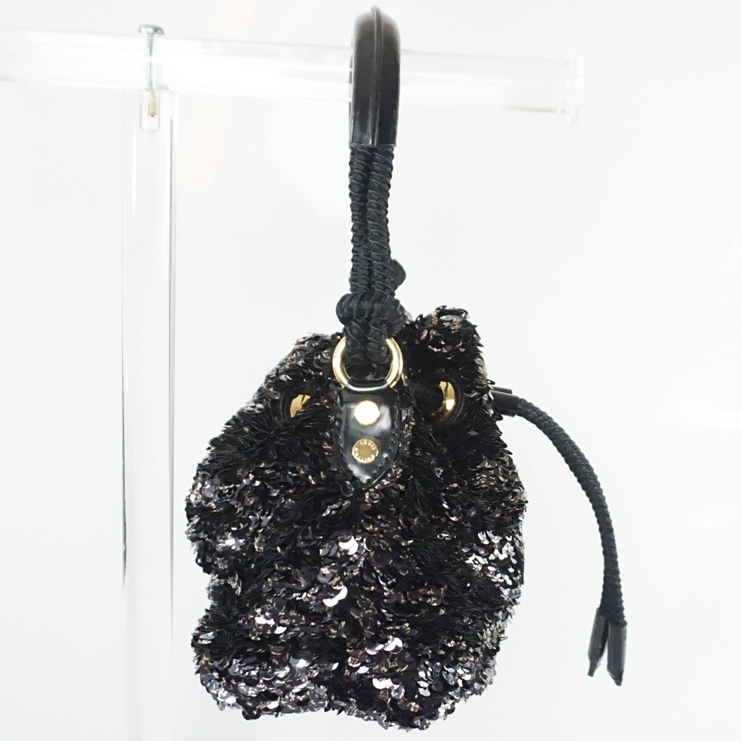 Louis Vuitton Black and Gold Limited Edition Sequin Mini Noe Rococo Handbag.  This handbag is in excellent condition and is from the cruise 2010 collection.

Measurements:
Width: 7.5