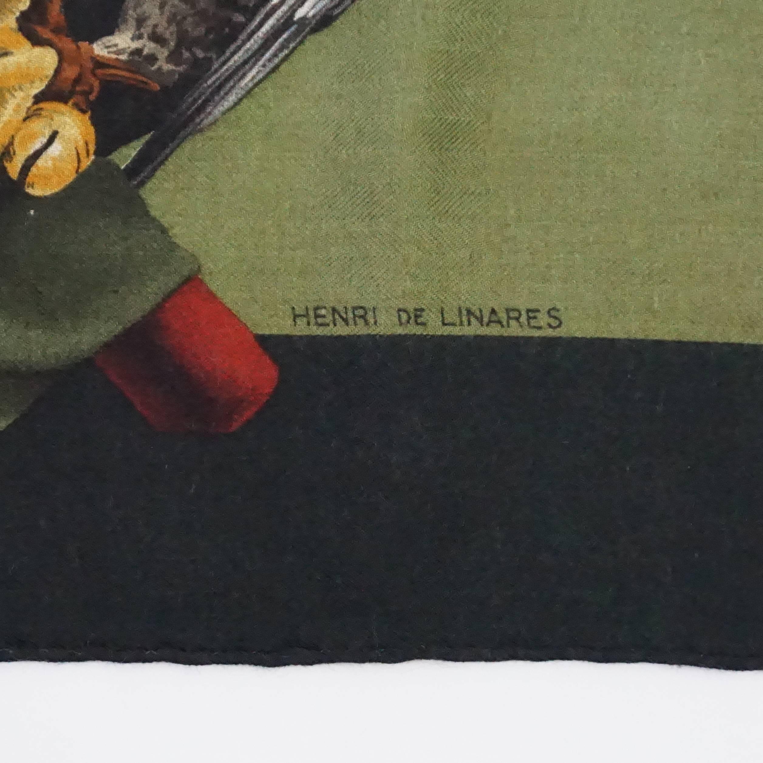 This Hermes olive green scarf is a cashmere blend and has a hawk print all over. The theme's title is 