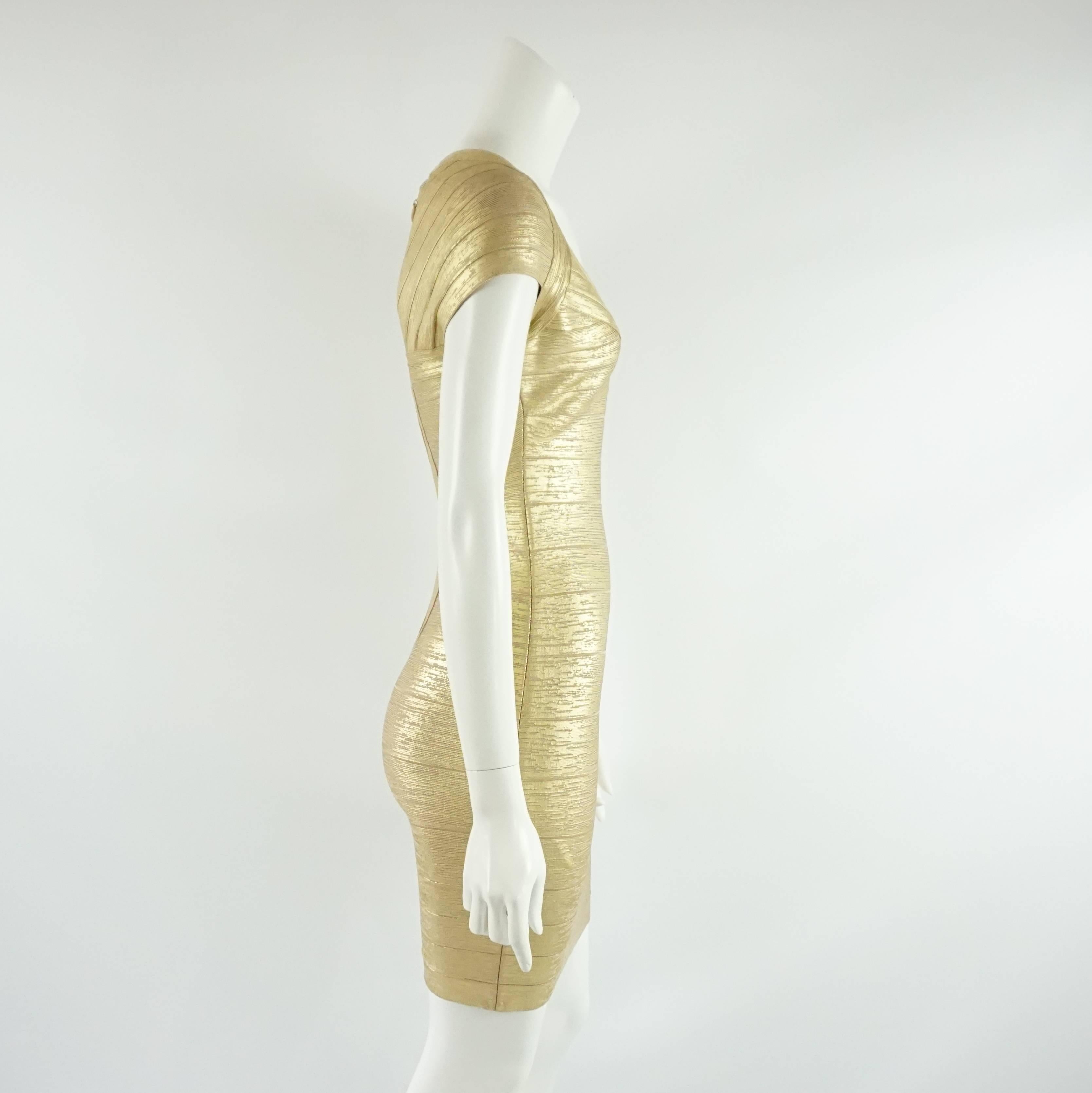 This Herve Leger dress is metallic gold. It has a bandage style and short sleeves. This dress is in excellent condition.

Measurements
Sleeve Length (from center back): 12"
Bust: 31" - 32"
Waist: 23"
Hips: 28"
Length: