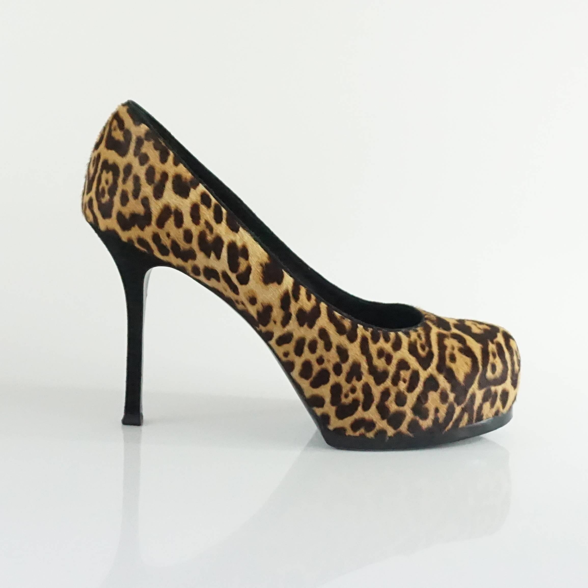These fun Yves Saint Laurent pony hair platform pumps feature an animal print. They are in very good condition with minor bottom wear and very slight wear to the pony hair.

Measurements
Heel Height: 4.5"
Platform Height: 1"