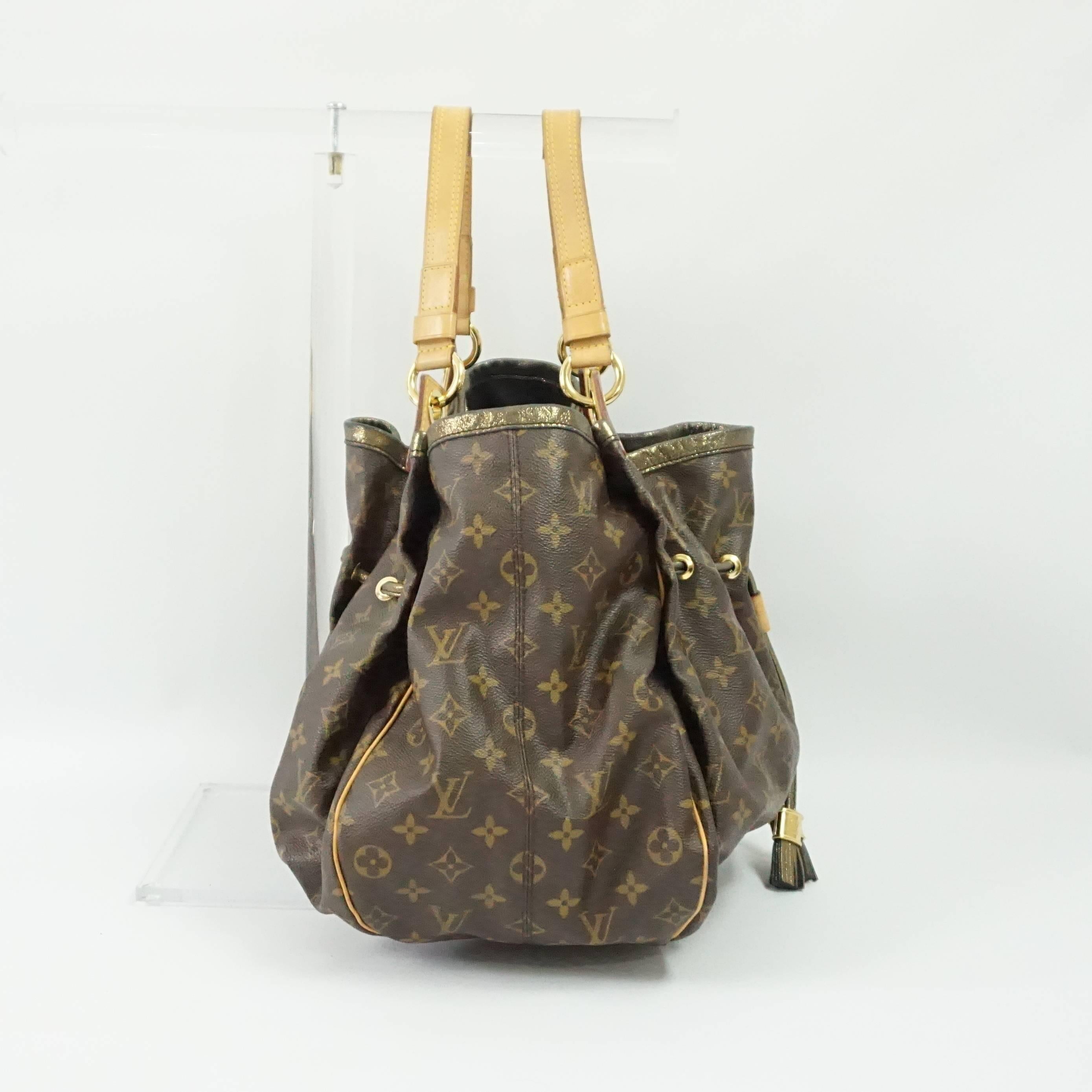 This gorgeous limited edition Louis Vuitton Irene shoulder bag is the brown monogram leather. It has gold hardware, a large zipper area inside, and two tassels on the outside. This beautiful bag is from 2009 and in excellent
