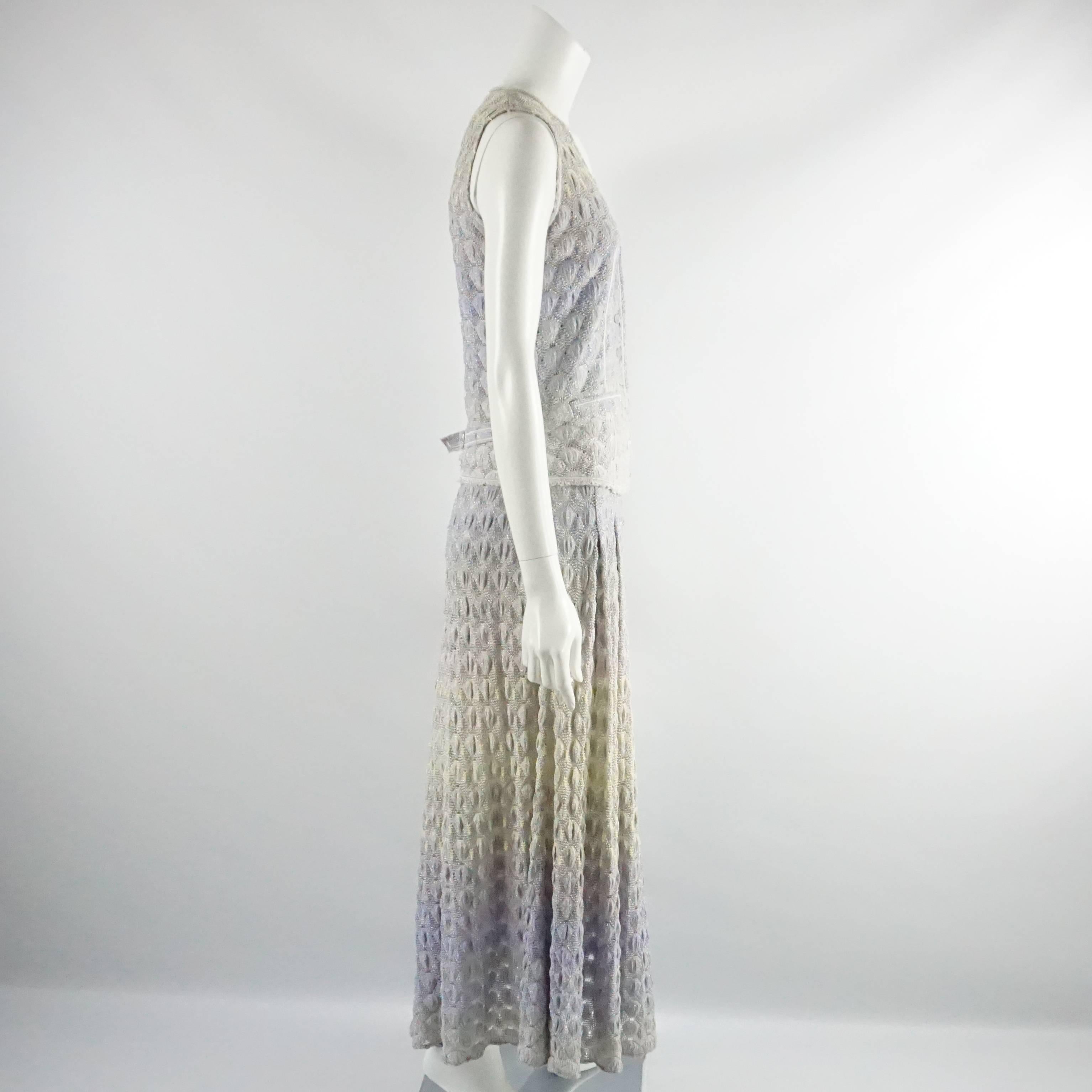 This Missoni knitted maxi dress is lavender, silver, and yellow. It has a sleeveless design, buttons down the front, side pockets, and a pleated skirt. This dress is in excellent condition. Size 40. 

Measurements
Bust: 34 in.
Waist: 30-32 in.
Hips: