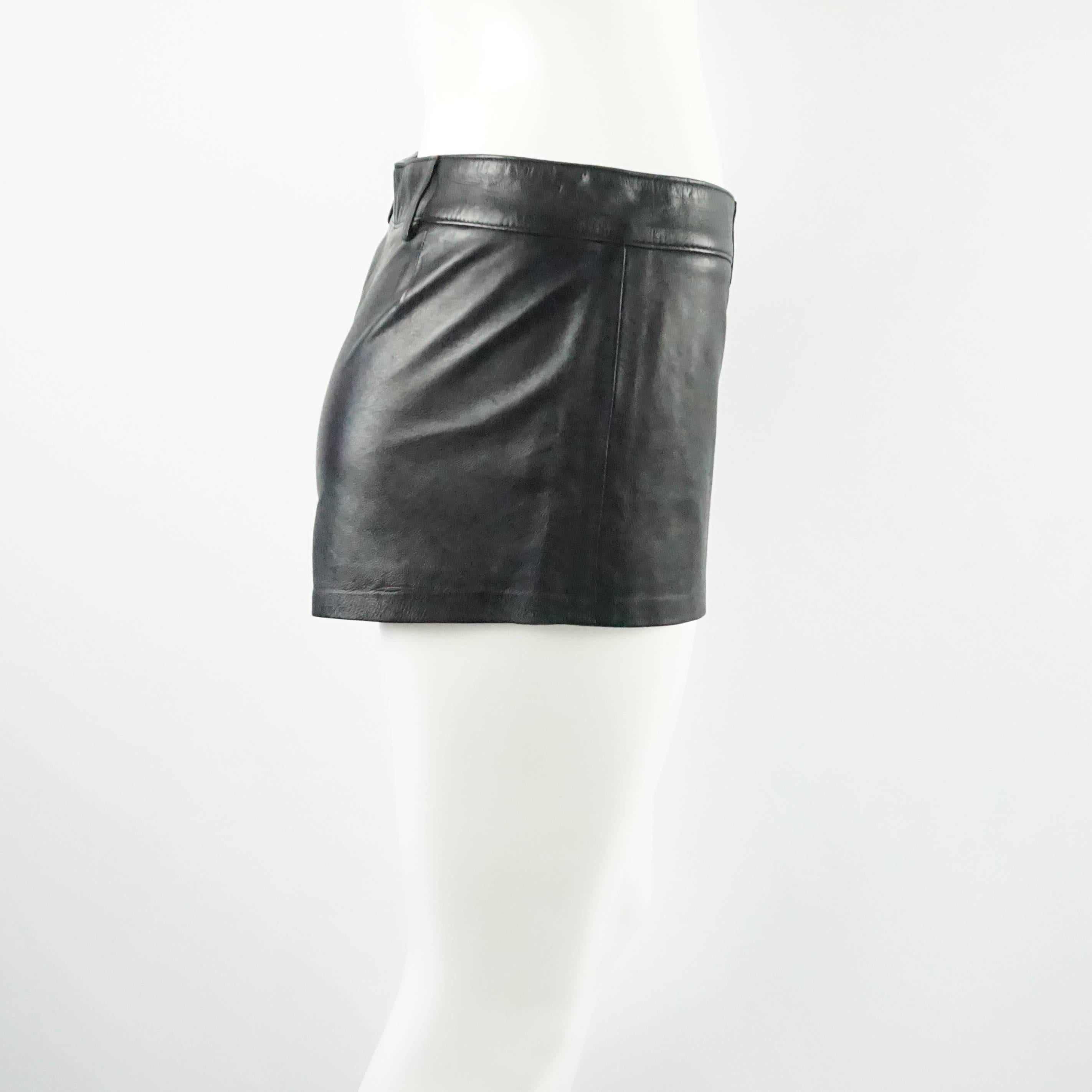 These Ralph Lauren Collection shorts are made of black leather. These shorts have belt loops and no pockets. They are in very good condition with a couple small areas of wear near the top of the shorts by the belt loops.

Measurements
Waist: