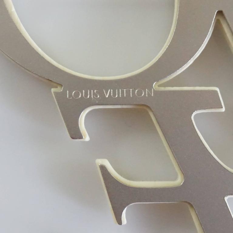 Louis Vuitton Cut Out World Map Leather Silver Tone Pin Brooch For Sale at  1stDibs
