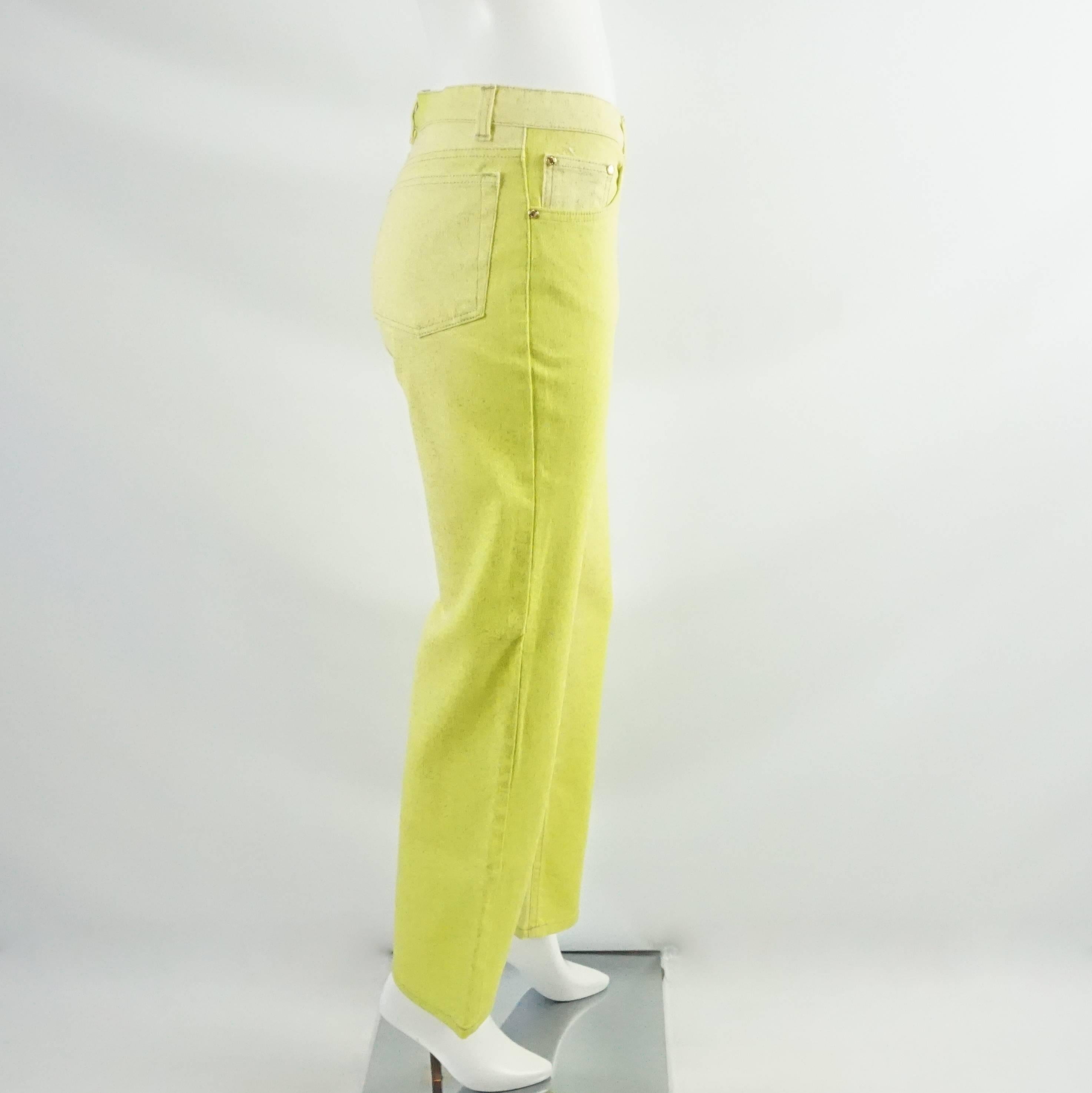 These Roberto Cavalli high waisted chartreuse and yellow jeans are a statement piece from the 90's which we all know is back in the runways and fashion magazines. They have glitter on them and belt loops. These jeans are in excellent condition with