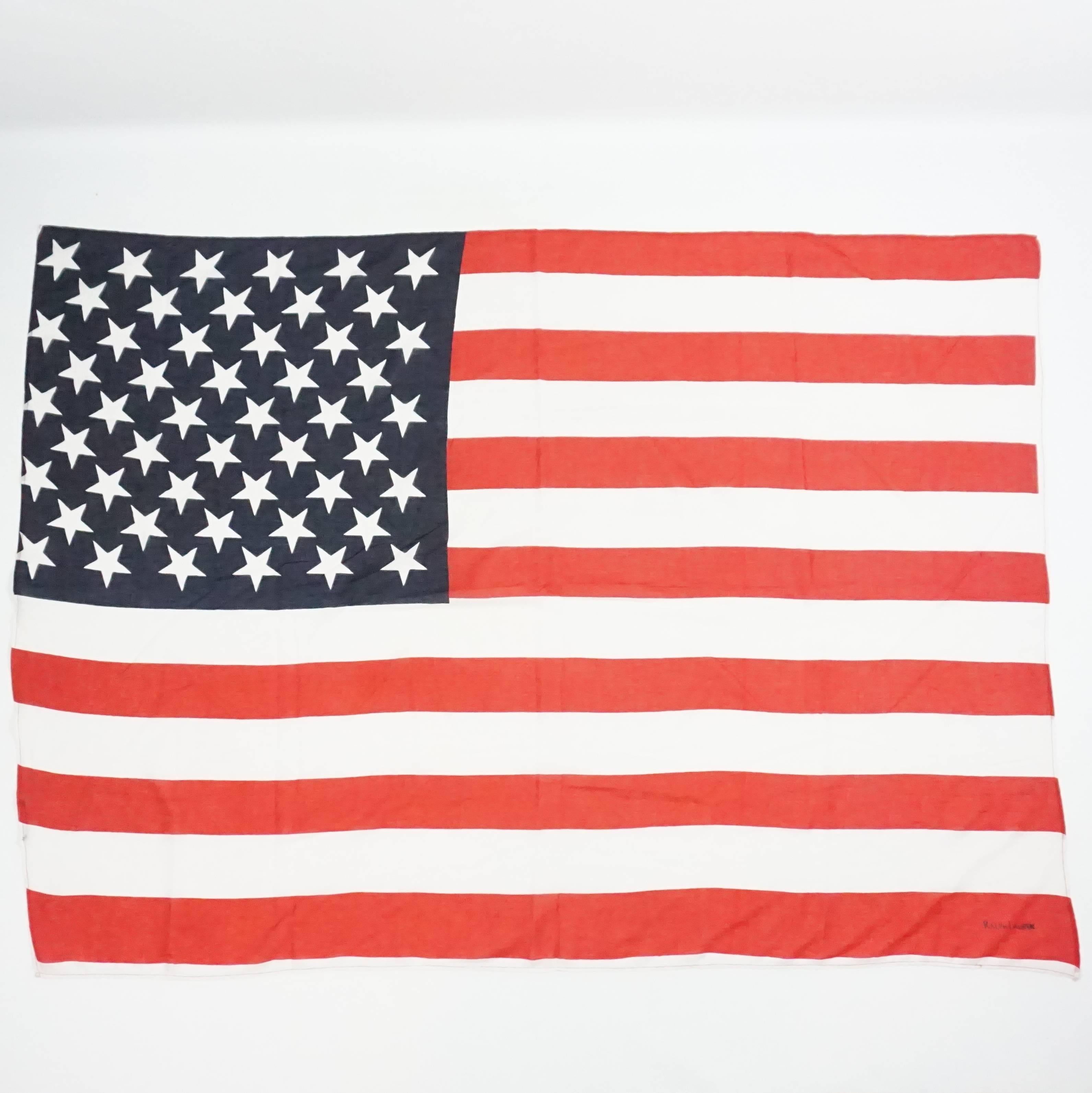 This Ralph Lauren American Flag scarf is red, white, and blue. It features the 13 stripes and 50 stars that the real flag has. This scarf is in good condition with some wear (a hole and staining). 

Measurements
Length:
Width: