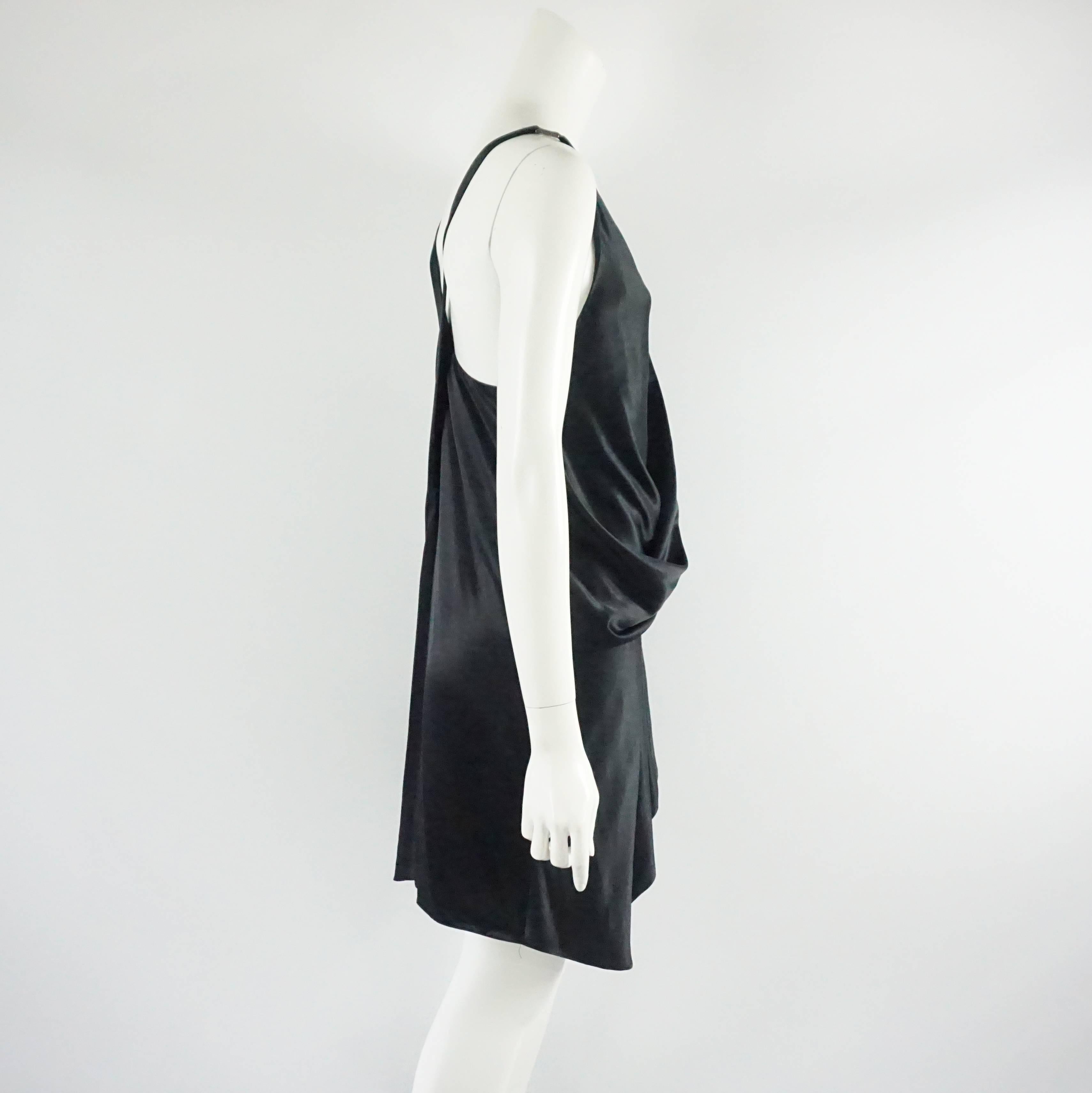 Helmut Lang Black Satin Dress with Crossing Straps - 6. This Helmut Lang dress is black satin. The straps cross each other in the back. In the front, there is a deep v-neck and the sides cross over each other leaving a billowy appearance. The skirt