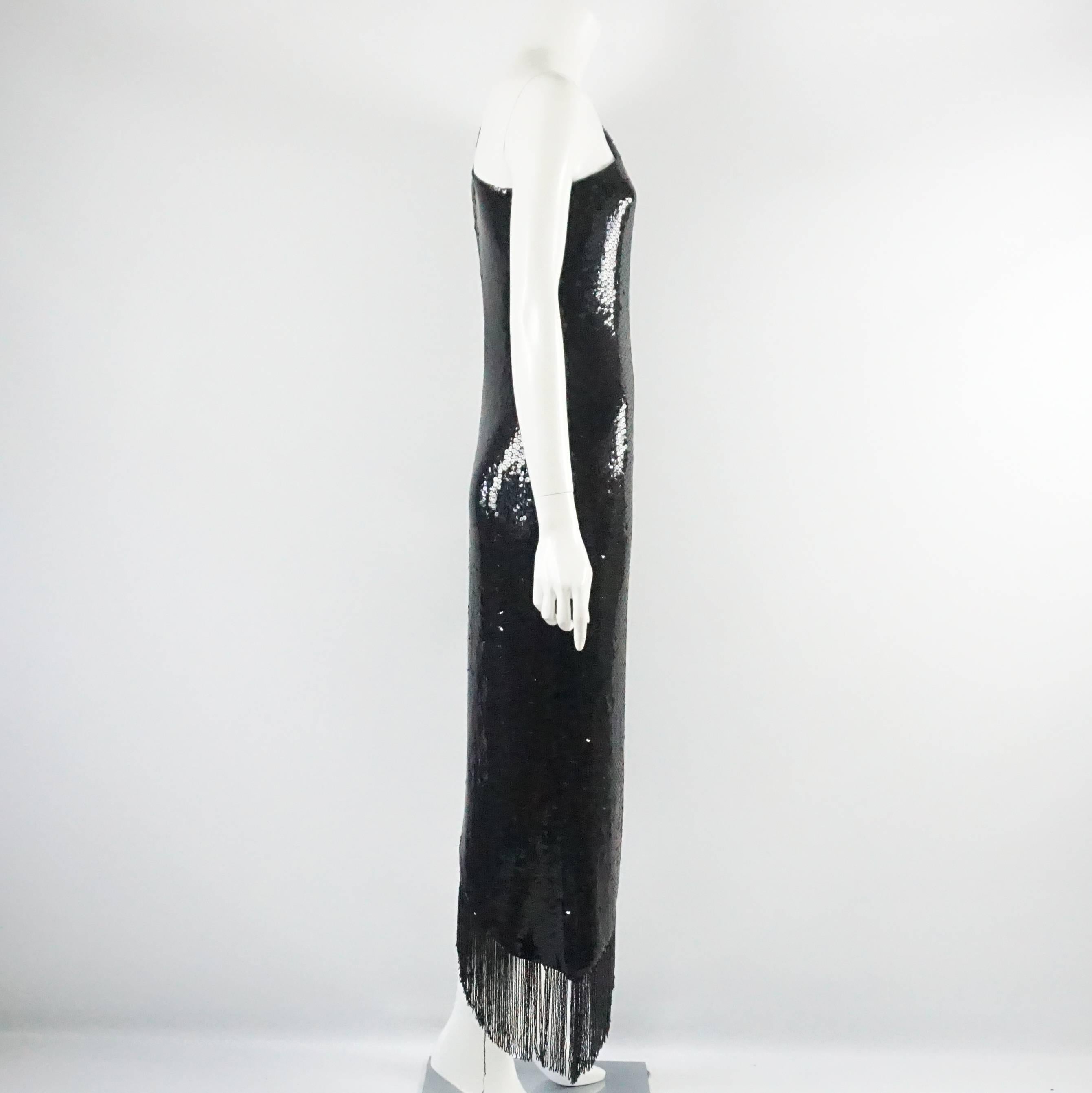 This vintage Bill Blass one shoulder gown and jacket are black and covered in sequins. There is a beaded fringe on the bottom of both pieces. The Bill Blass tag is no longer on this piece but it is 100% authentic. This gown and matching jacket are