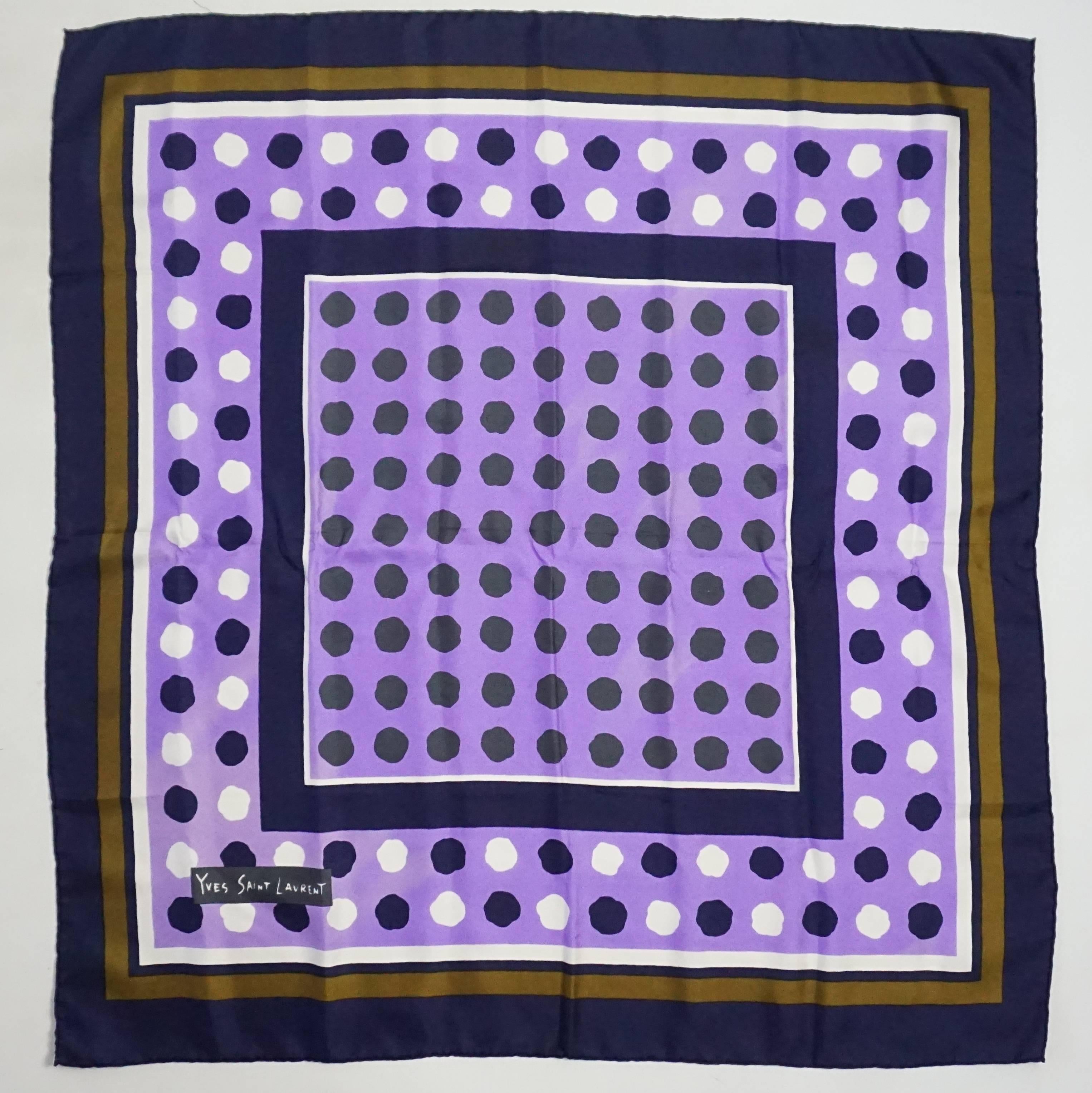 This YSL scarf is lavender, navy, white, and tan. The scarf is made of silk and has polka dots all over with squares around them. It is in good condition with  minimal staining and discolorations as seen in the last images. 

Measurements
Height: