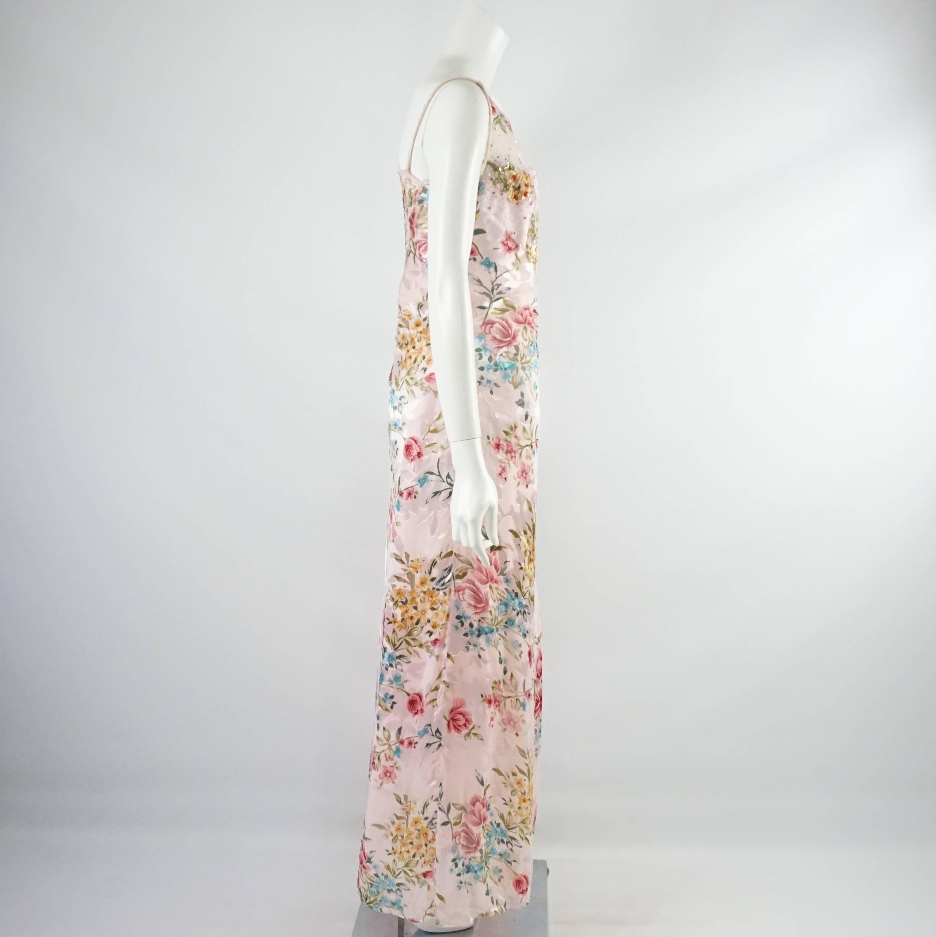 This Bellville Sassoon gown is pink silk with a floral beaded design. It is sleeveless and has a high neckline. This gown is in good condition with some loose and missing embellishments. Size 10.

Measurements
Bust: 34