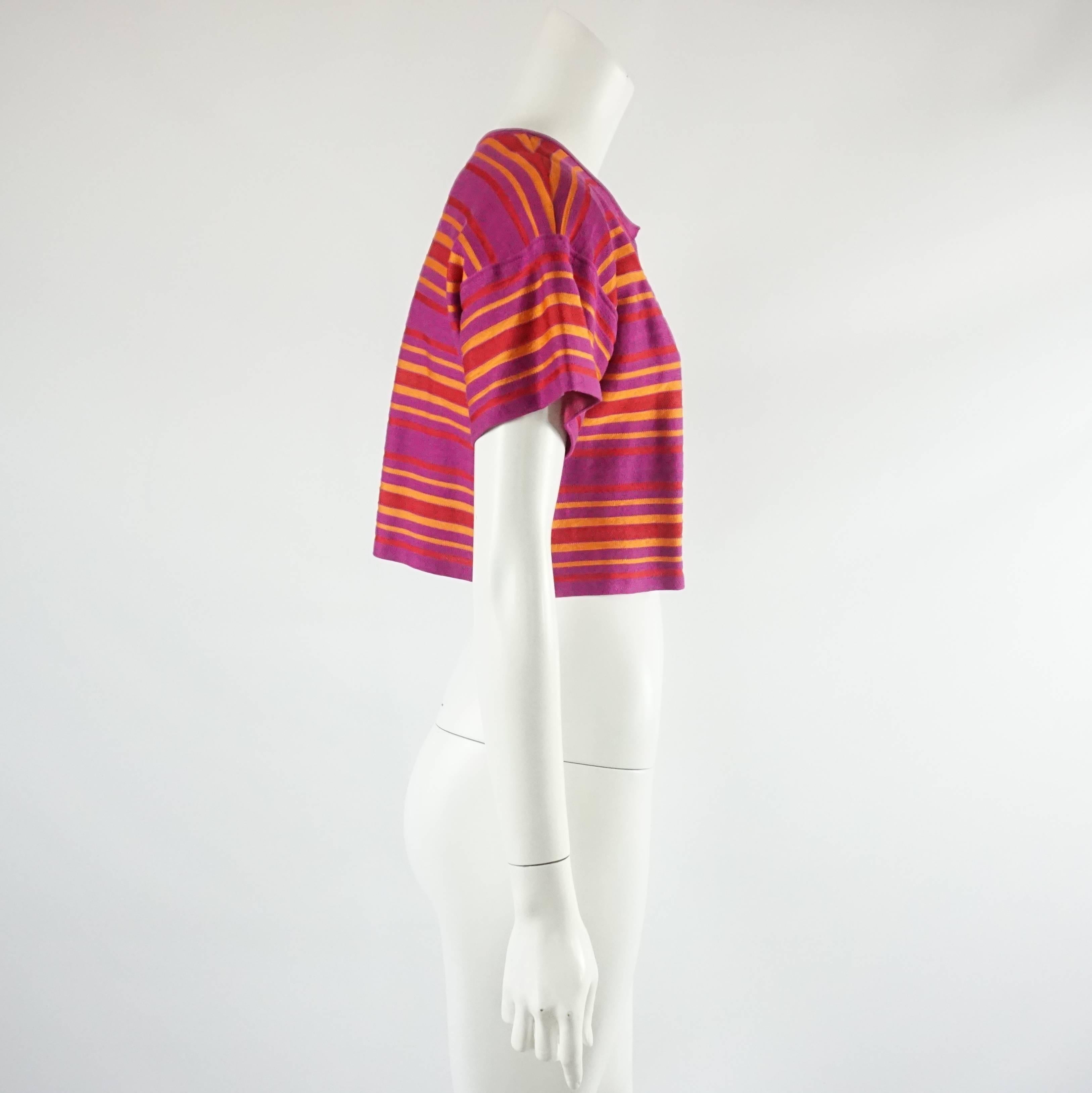 M Missoni Pink, Red and Orange Cotton Knit Bolero - 6  This very colorful missoni piece is a perfect add on for any outfit. It has a horizontal striped pattern, a short sleeve, a hook and eye closure at the top and has a drop sleeve. This top is in