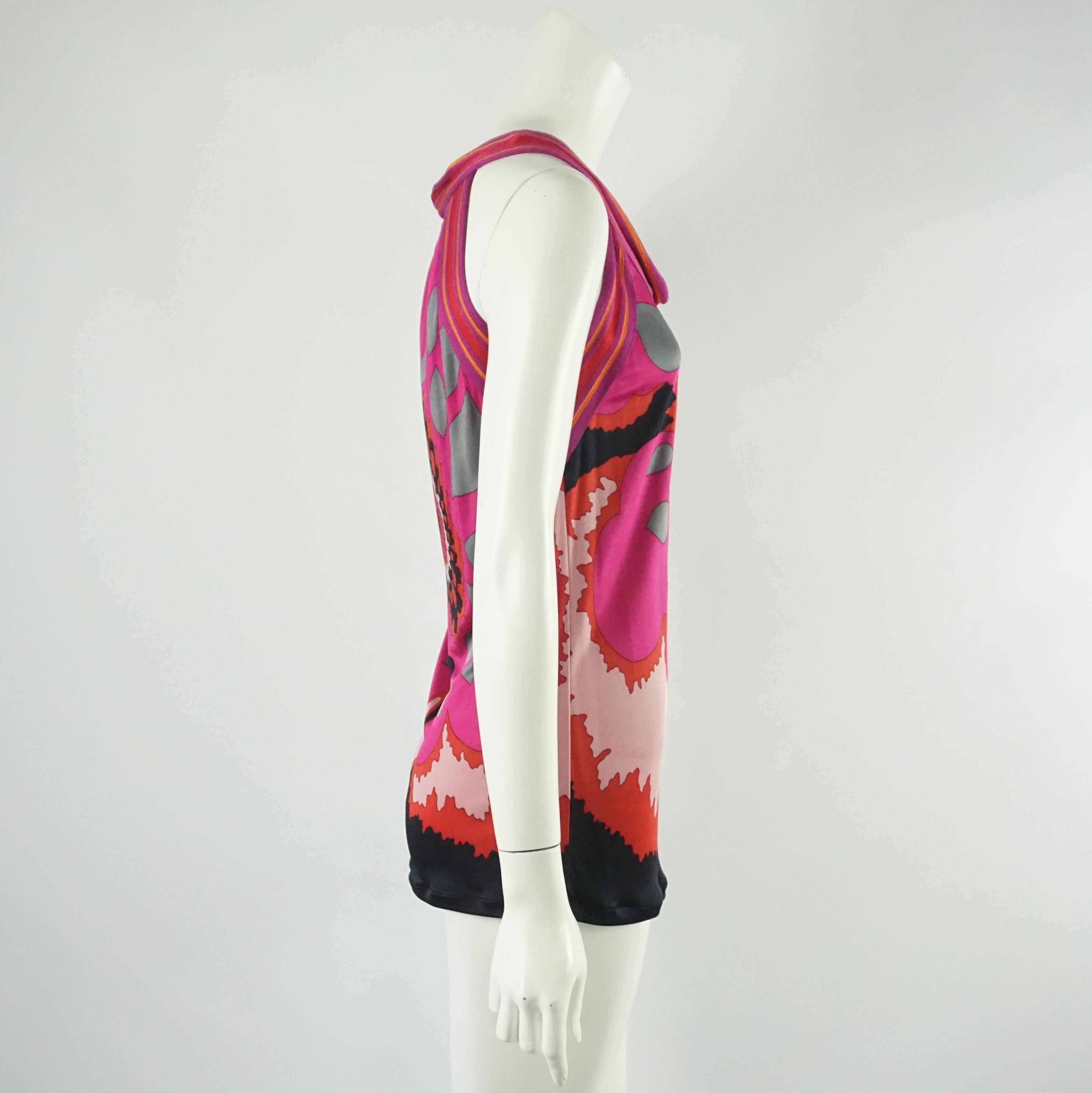 M Missoni Pink and Red Print Jersey and Cotton Knit Top - 6  This M Misson top has a beautiful fuchia, pinks, orange , reds, grey and black print. The neckline and the armhole are trimmed in a woven cotton knit. It is sleeveless and has quite a bit