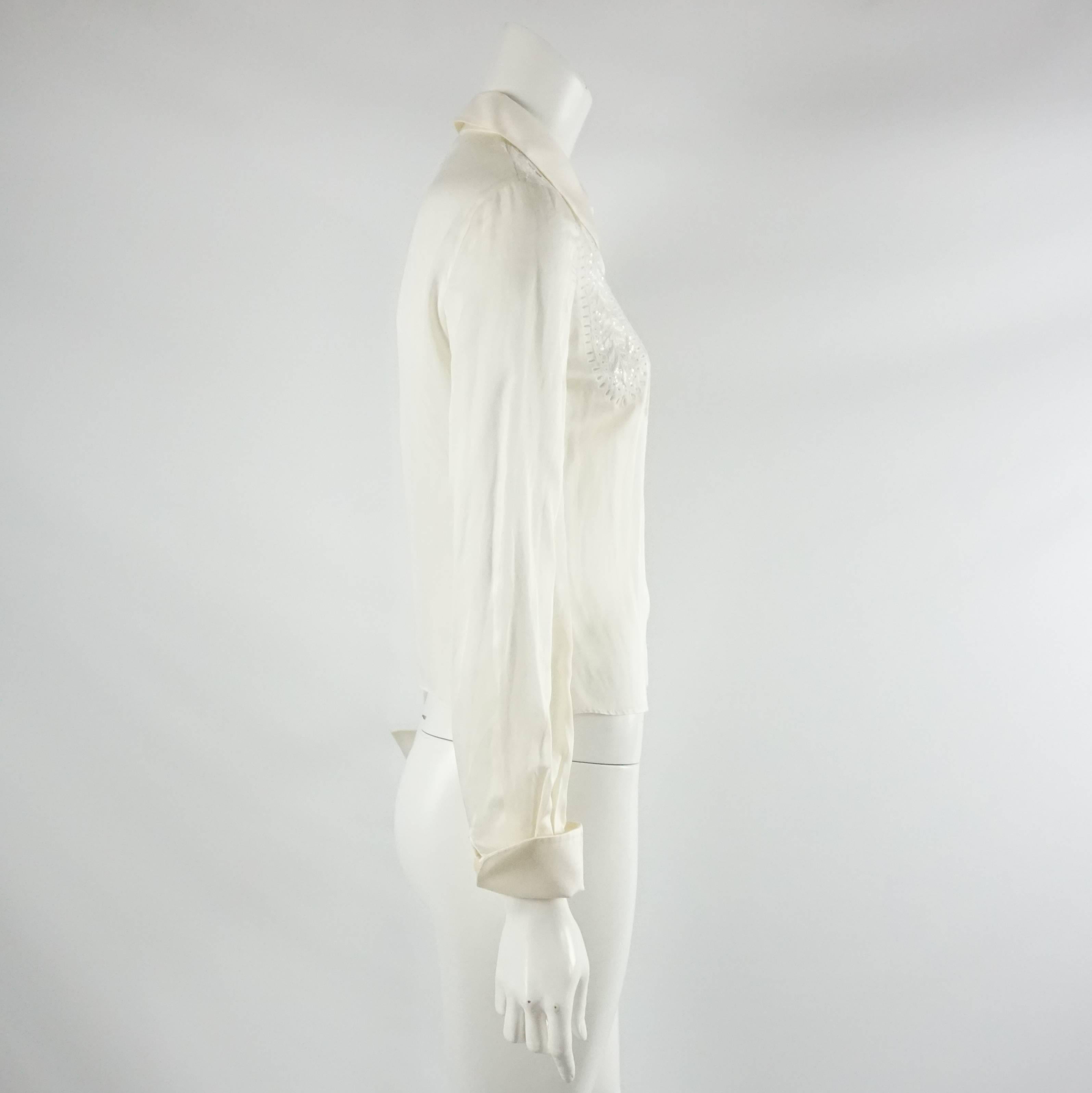 Valentino Ivory Silk Long Sleeve Top w/ Eyelet Detail-4. This beautiful Valentino long sleeve top is in great condition. It is ivory with buttons down the front. The top is made of silk and has an eyelet detail with sequins on the front and has a