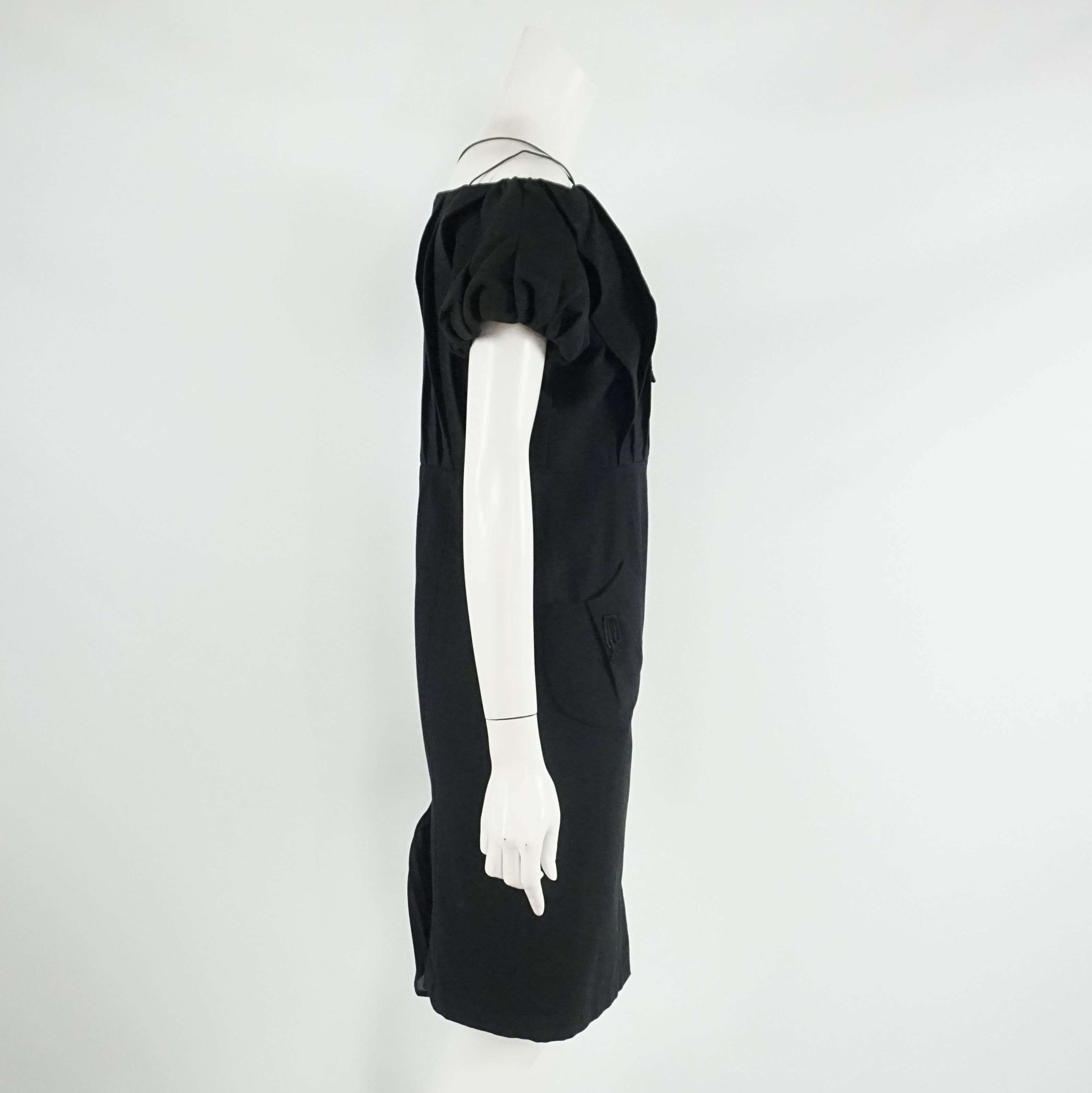Thierry Mugler Black Pique Dress - 40 - Circa 90's This blast from the past fabulous cotton pique dress has short semi puffy sleeve, square neckline with a lace up detail along the top, snap buttons all the way down the front, two path pockets,