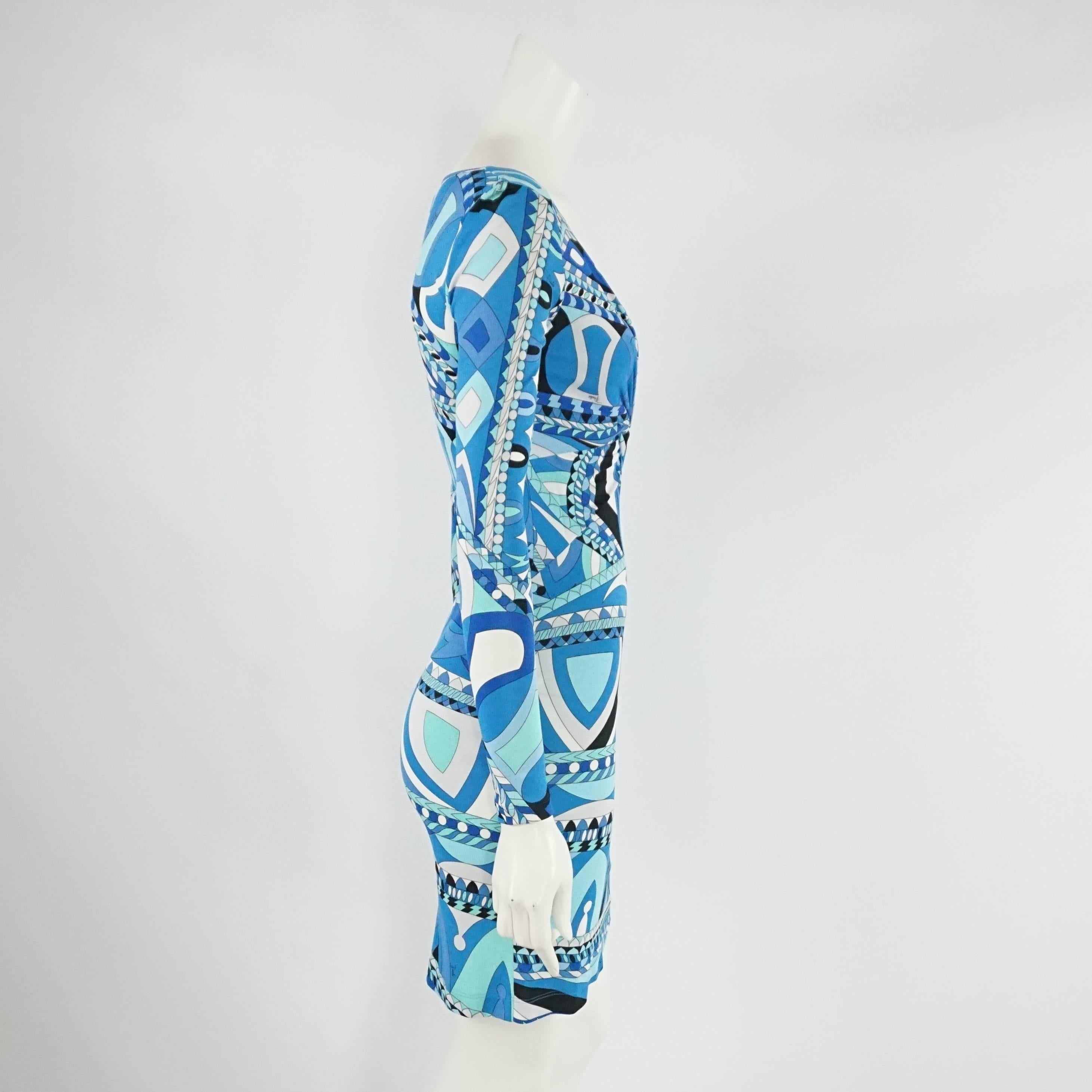 Emilio Pucci Blue Print Silk Jersey Dress - 4   This beautiful long sleeve blue print Pucci dress is perfect for any occasion. It has a V neck with a twisted drape detail . This item is in excellent conditoin. Size 4

Measurements
Shoulder to