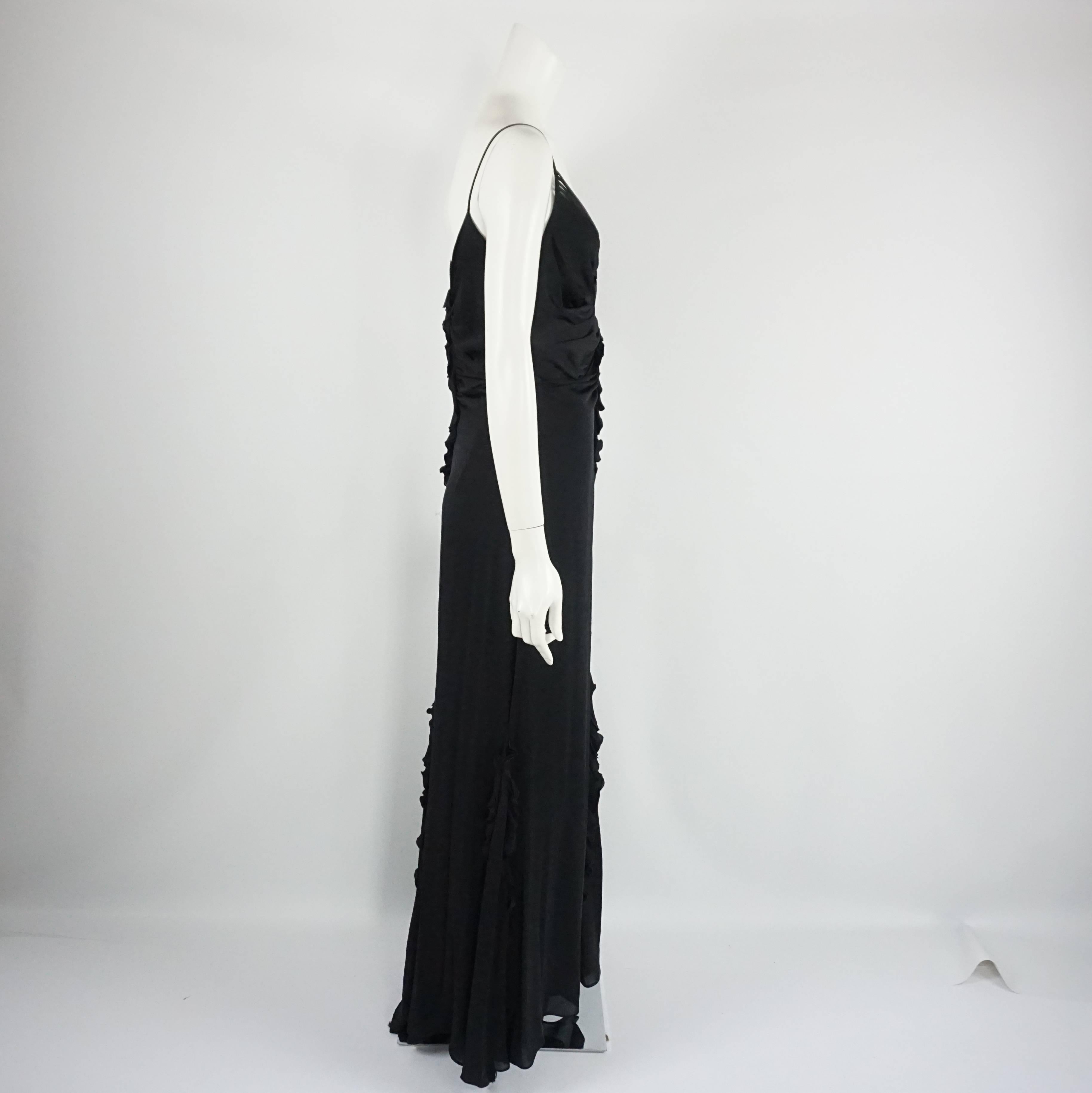 Badgley Mischka Black Jersey Ruched Gown - 10. This Badgley Mischka black jersey gown is the perfect evening gown. It features ruching near the bust and waist, a lace-up style bust detail, bottom ruffles, and a bustle option. The gown is in very