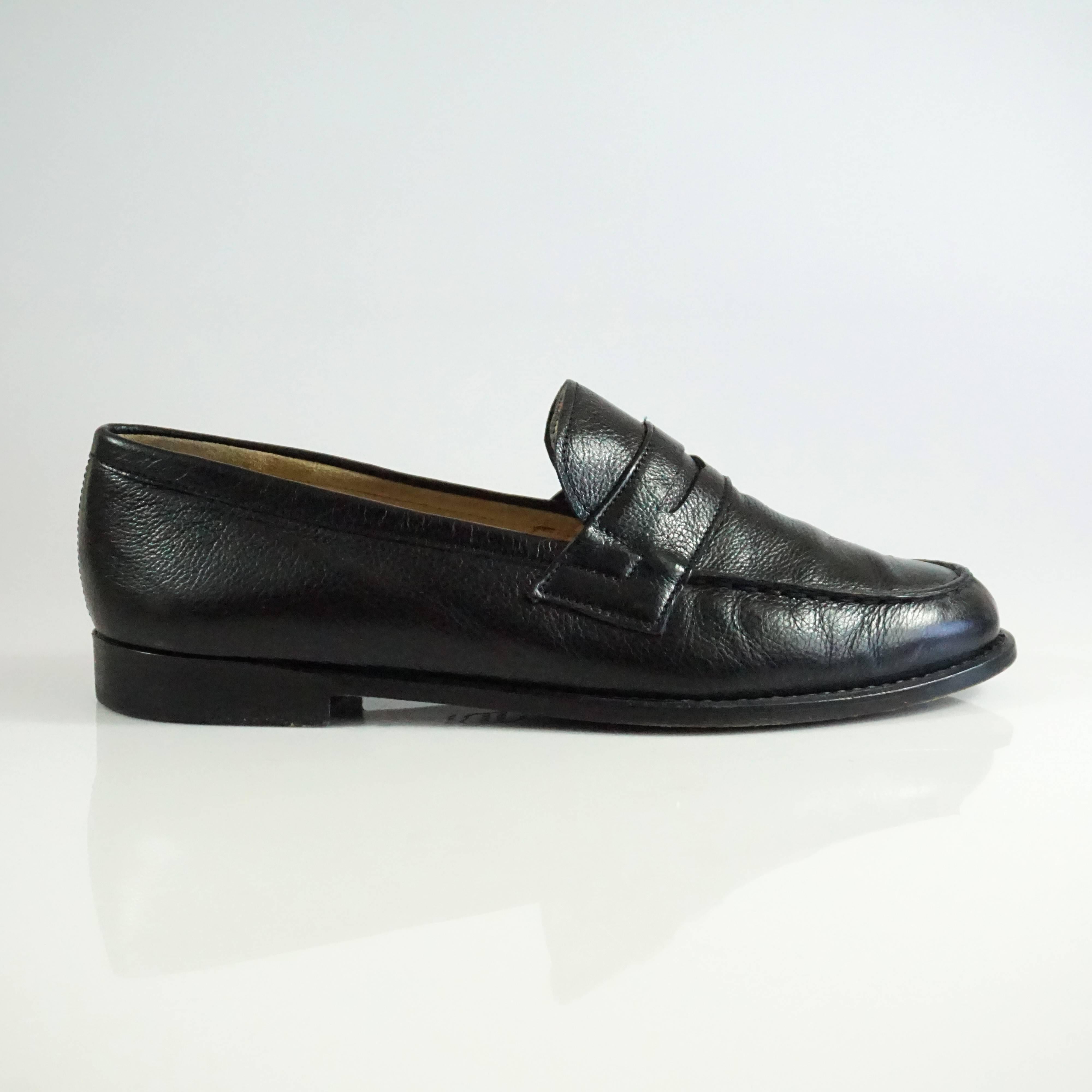 These classic Manolo Blahnik loafers are black leather. They are in very good condition with minimal wear on the bottom and the tips of the shoes. Size 37.5