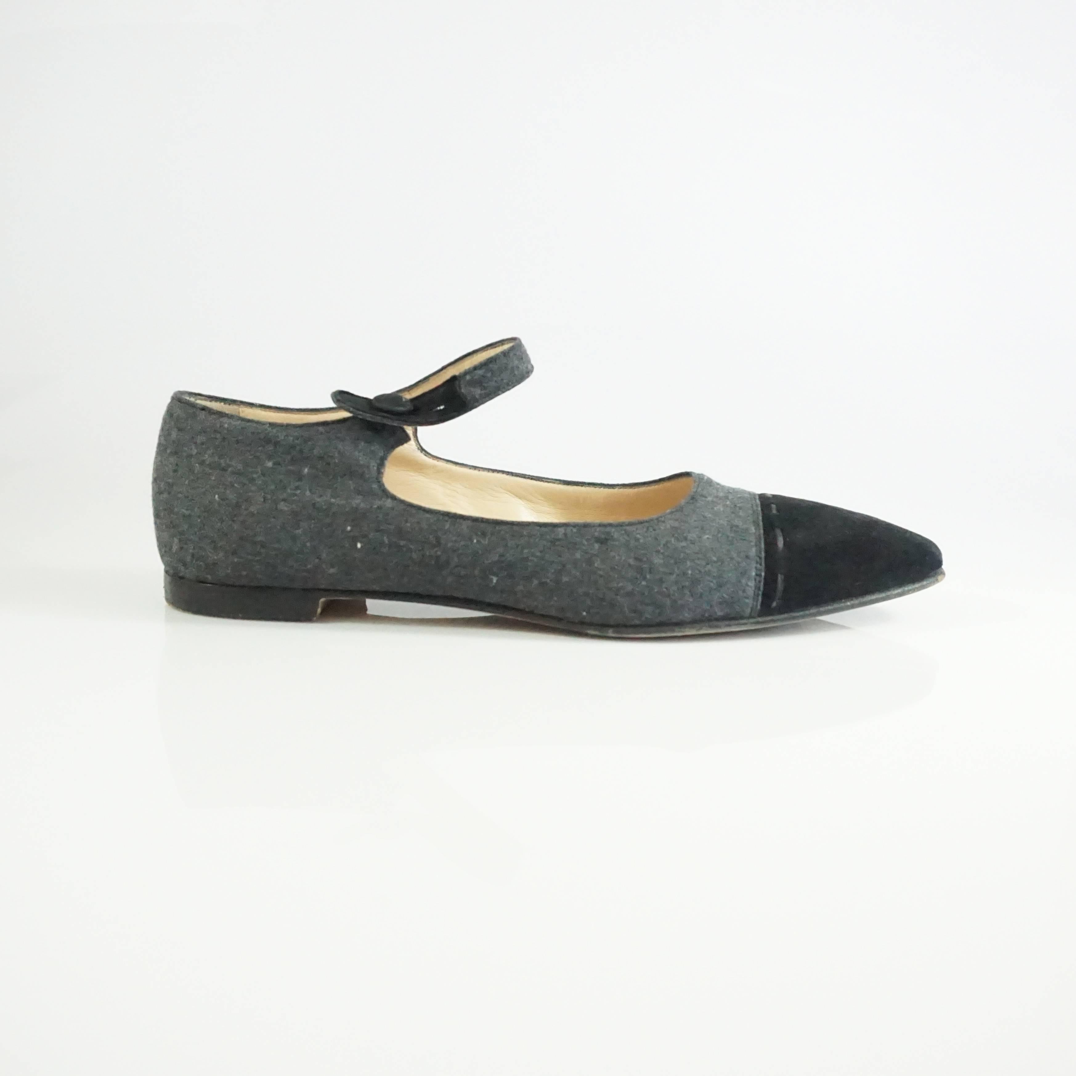 Manolo Blahnik Grey Wool and Black Suede Mary Jane Style Shoes-37.5  These fabulous classic style shoes are made of grey wool and have a black toe box with black leather stitching and a black suede accents on the strap. These shoes are in excellent