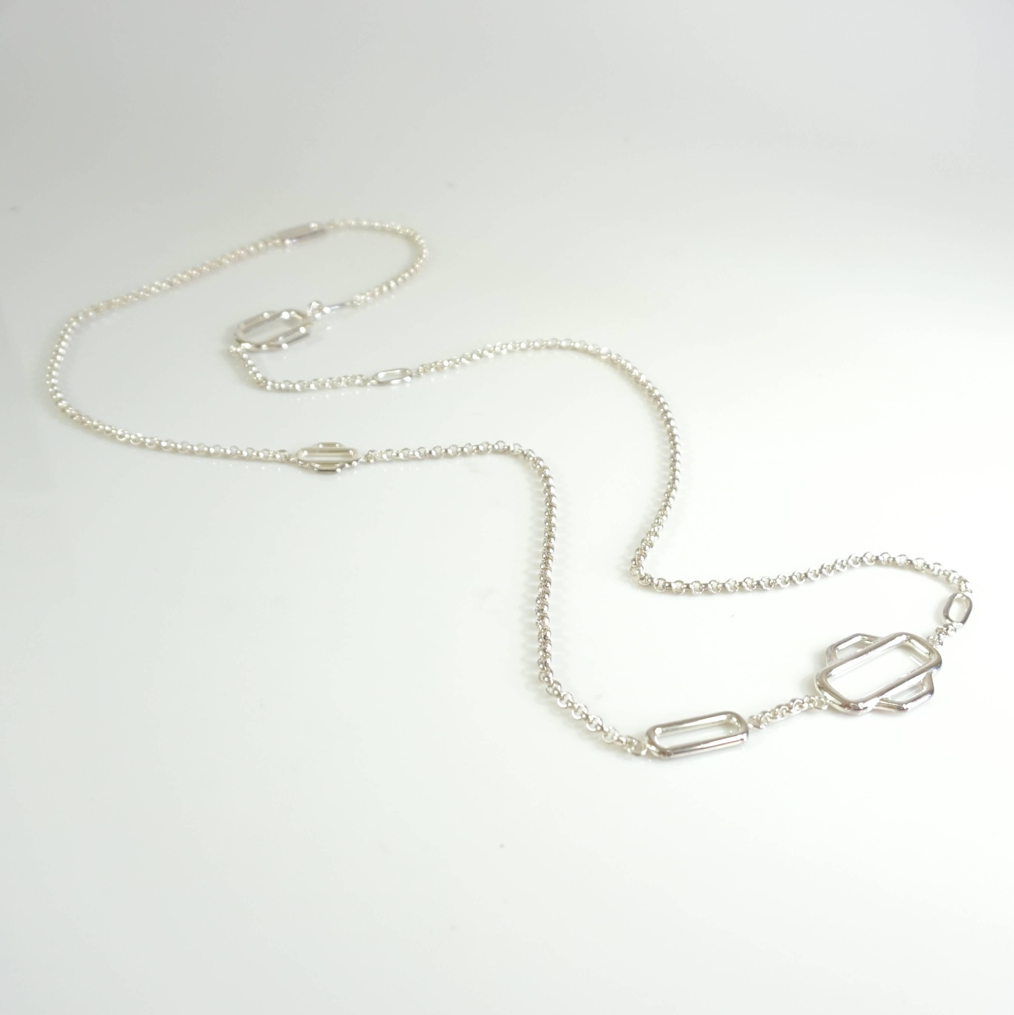 This Hermes drop necklace is very versatile and can be worn at various lengths. It is made of sterling silver and has various equestrian harness style links. The piece is in excellent condition with very minimal wear to the silver (see the last