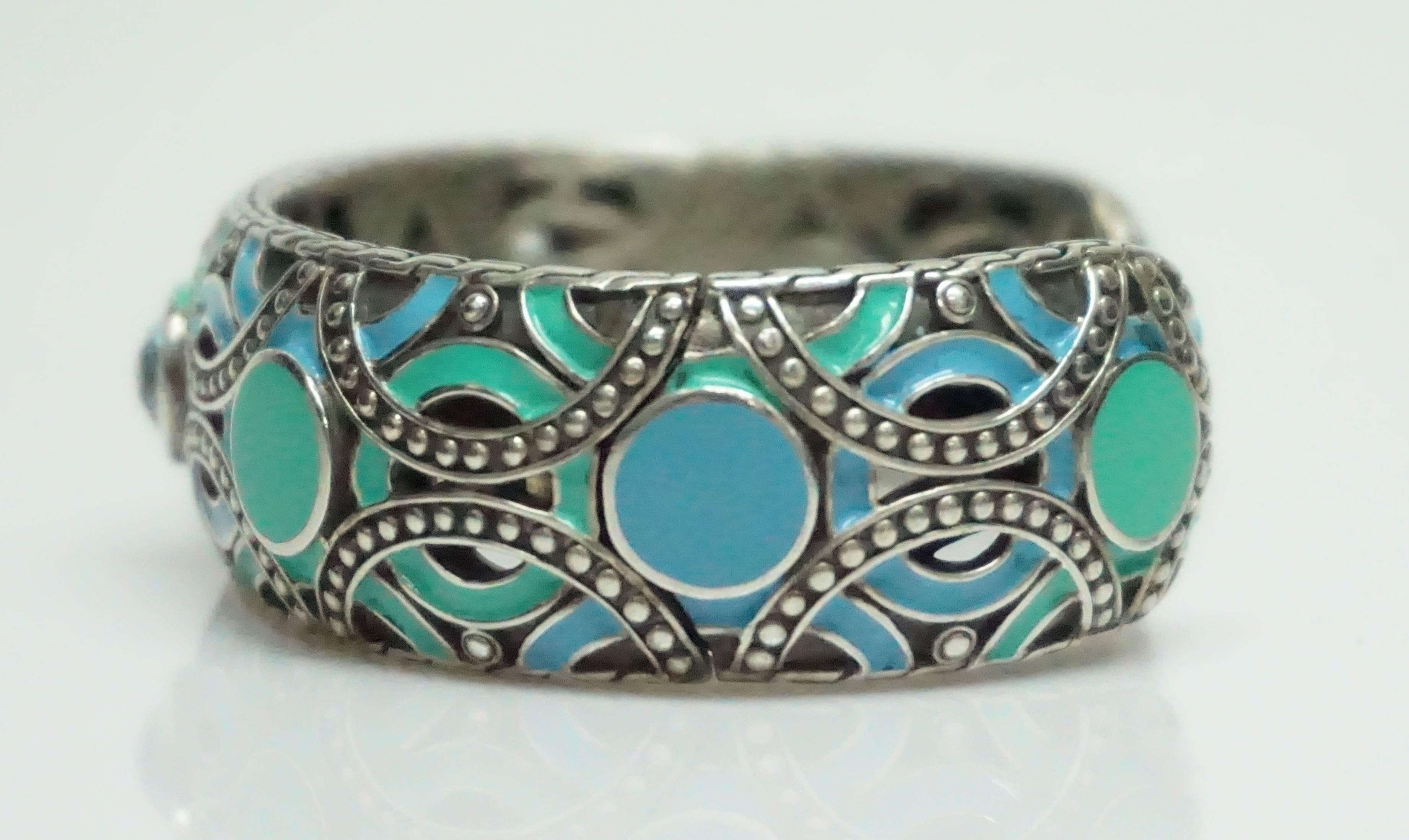 John Hardy Sterling Silver and Turq/Blue Enamel Bracelet w/ Blue Topaz  This beautiful sterling silver bracelet is in excellent condition. The bracelet has circular and half circle details throughout. The outside of the bracelet has turquoise