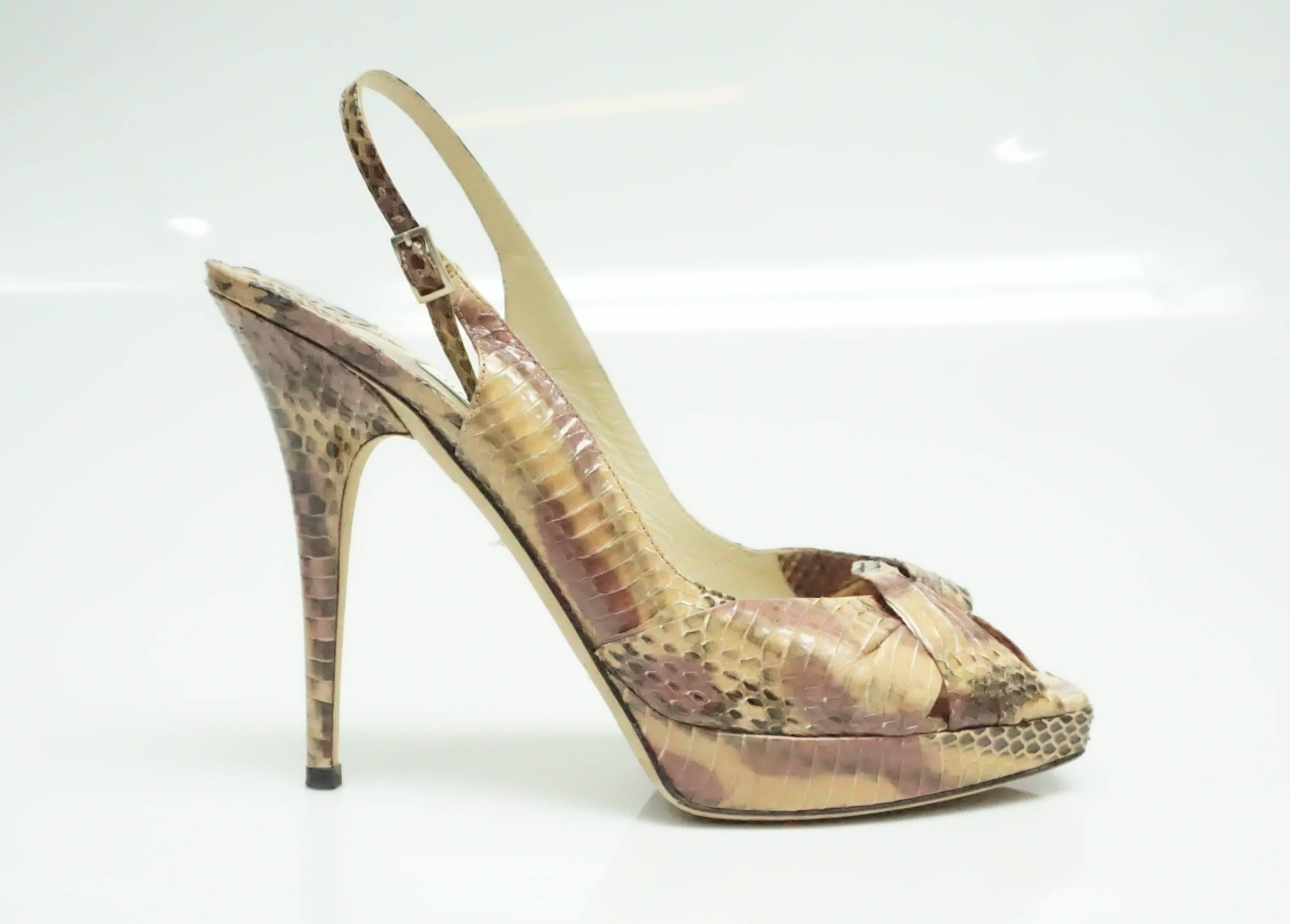 Jimmy Choo Pink Python Slingbacks - 40  These python pumps are in good condition. They consist of colors ranging from pink, nude, and brown. They have a peep toe that has a crossing over effect. The inside of the shoe has some wear on it and the