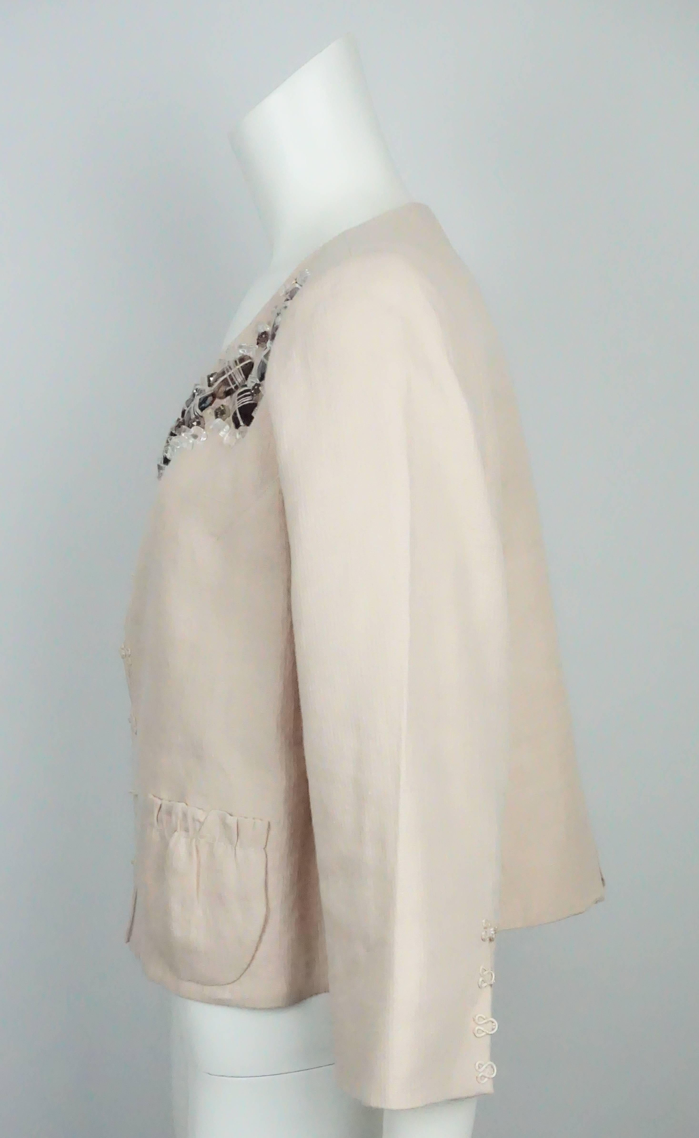 Robert Rodriguez Rose Peach Linen Jacket w/ Stone Embellished Detail - 10  This jacket is fully lined, has two front patch pockets and the front and sleeves has cord like covered hook and eye closures. The entire front neckline has clear, brown and