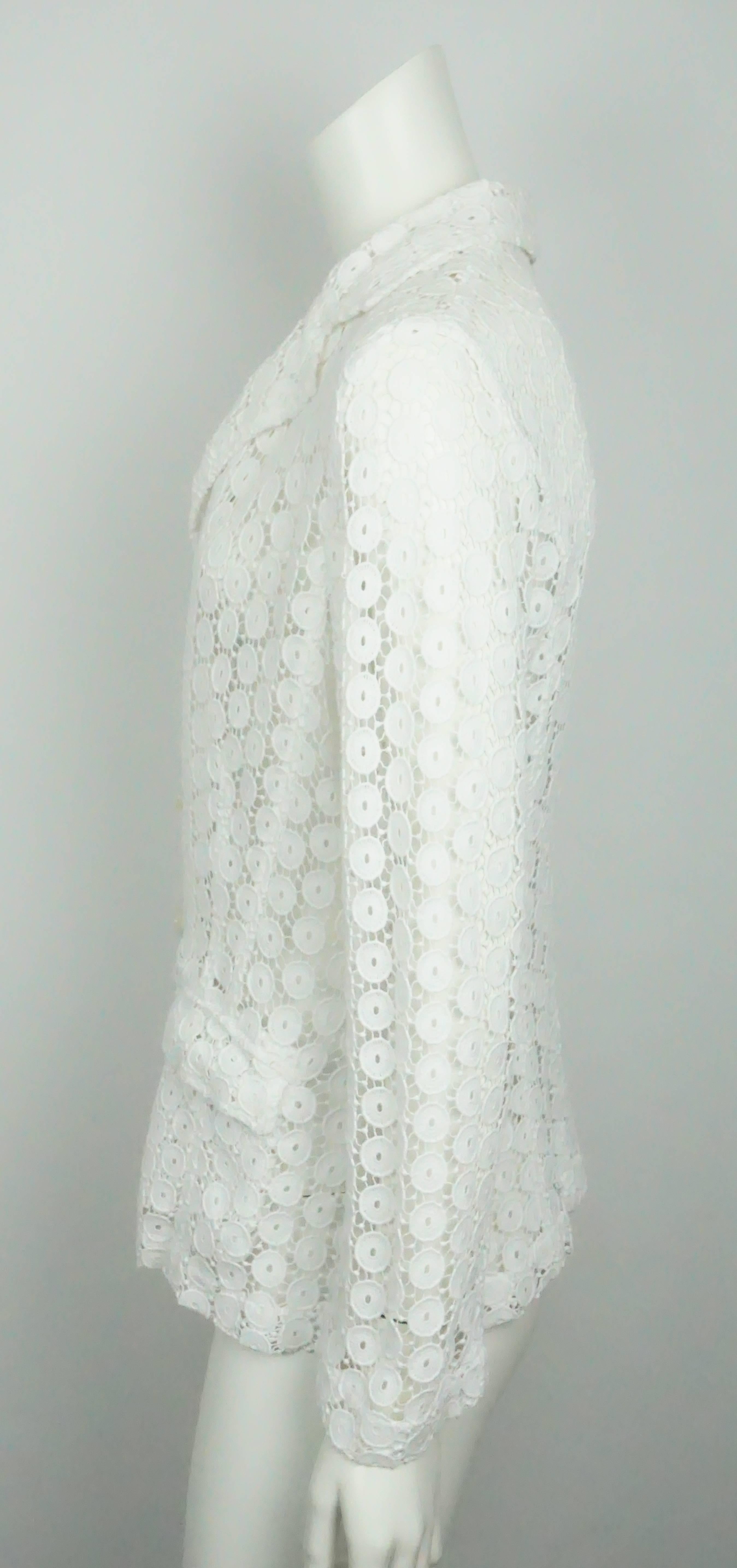 Anne Fontaine White Lace Jacket - 40   This stunning cotton lace jacket is in excellent condition. The jacket is completely made of this cotton material that is formed into these circle shapes. There is no lining and there is one functional front