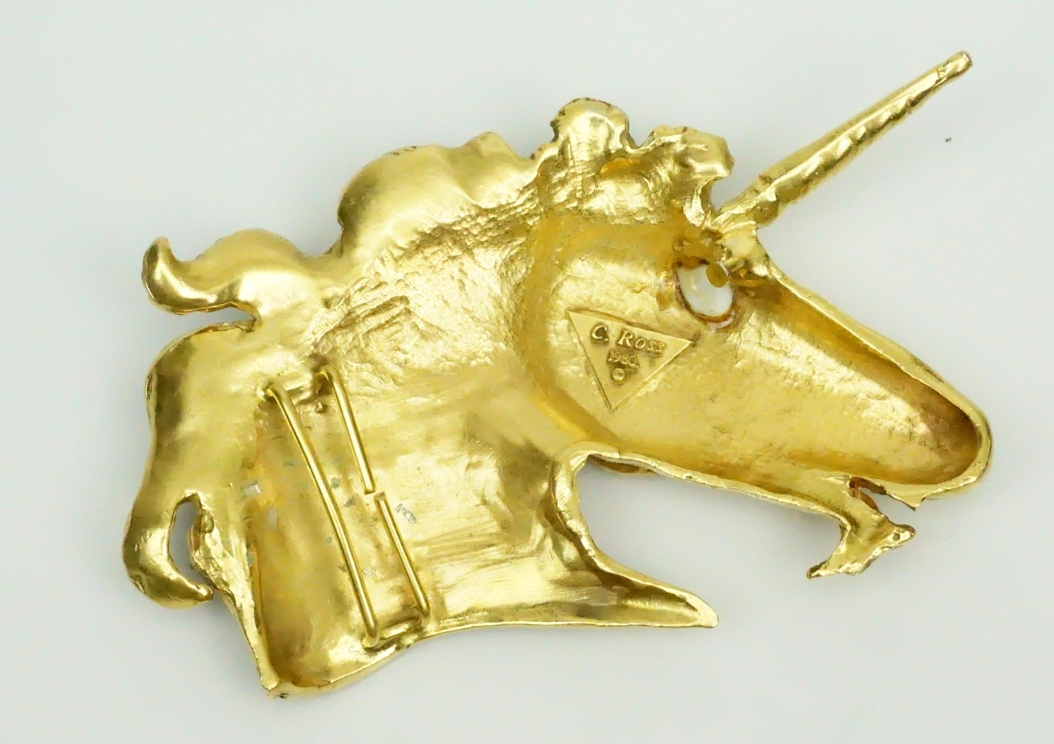 Christopher Ross Gold Unicorn Head Belt Buckle - Circa 1980  This very collectible buckle is in excellent vintage condition.
Measurements 
Height: 3