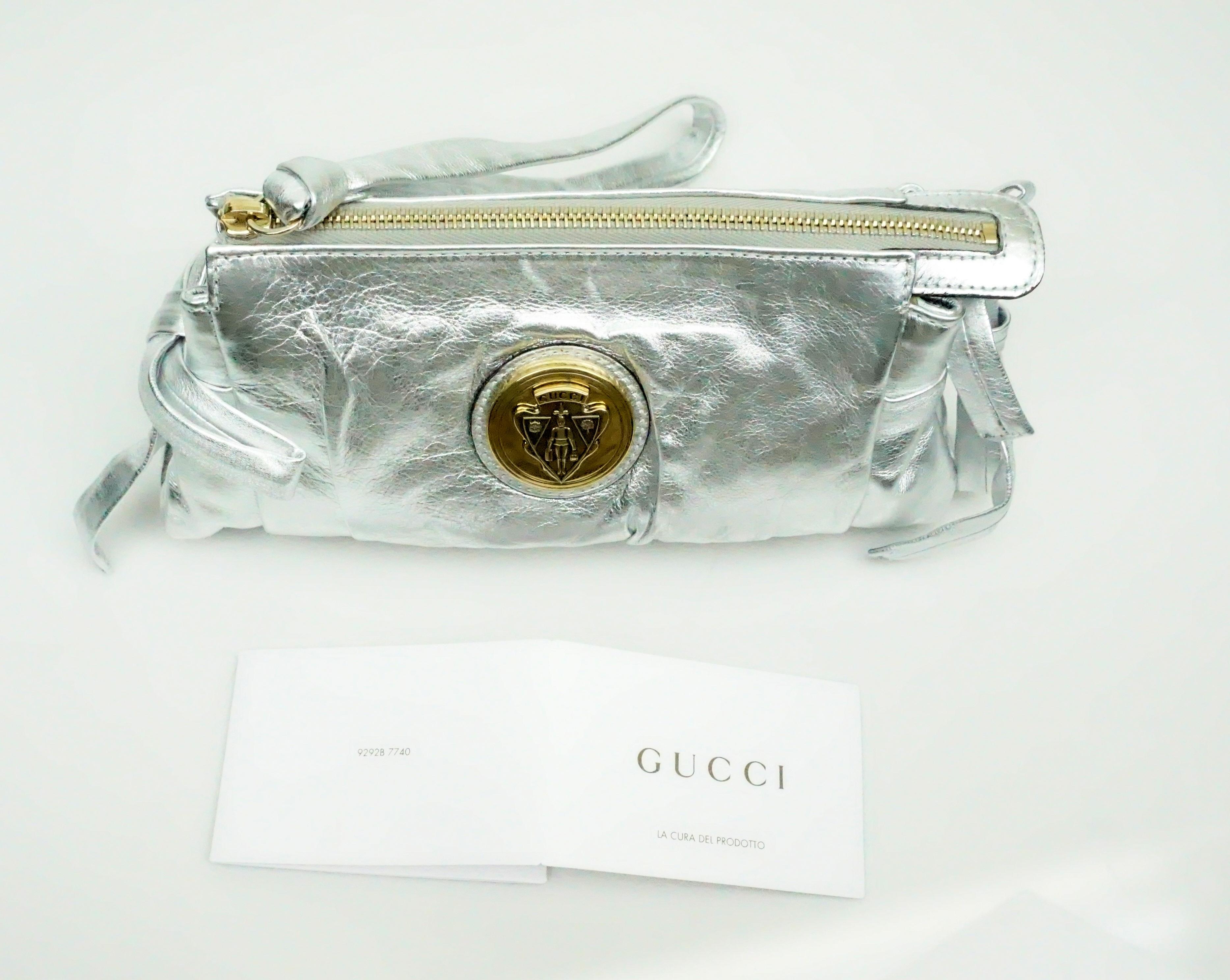 Women's or Men's Gucci Silver Metallic Leather Clutch with Gold Emblem