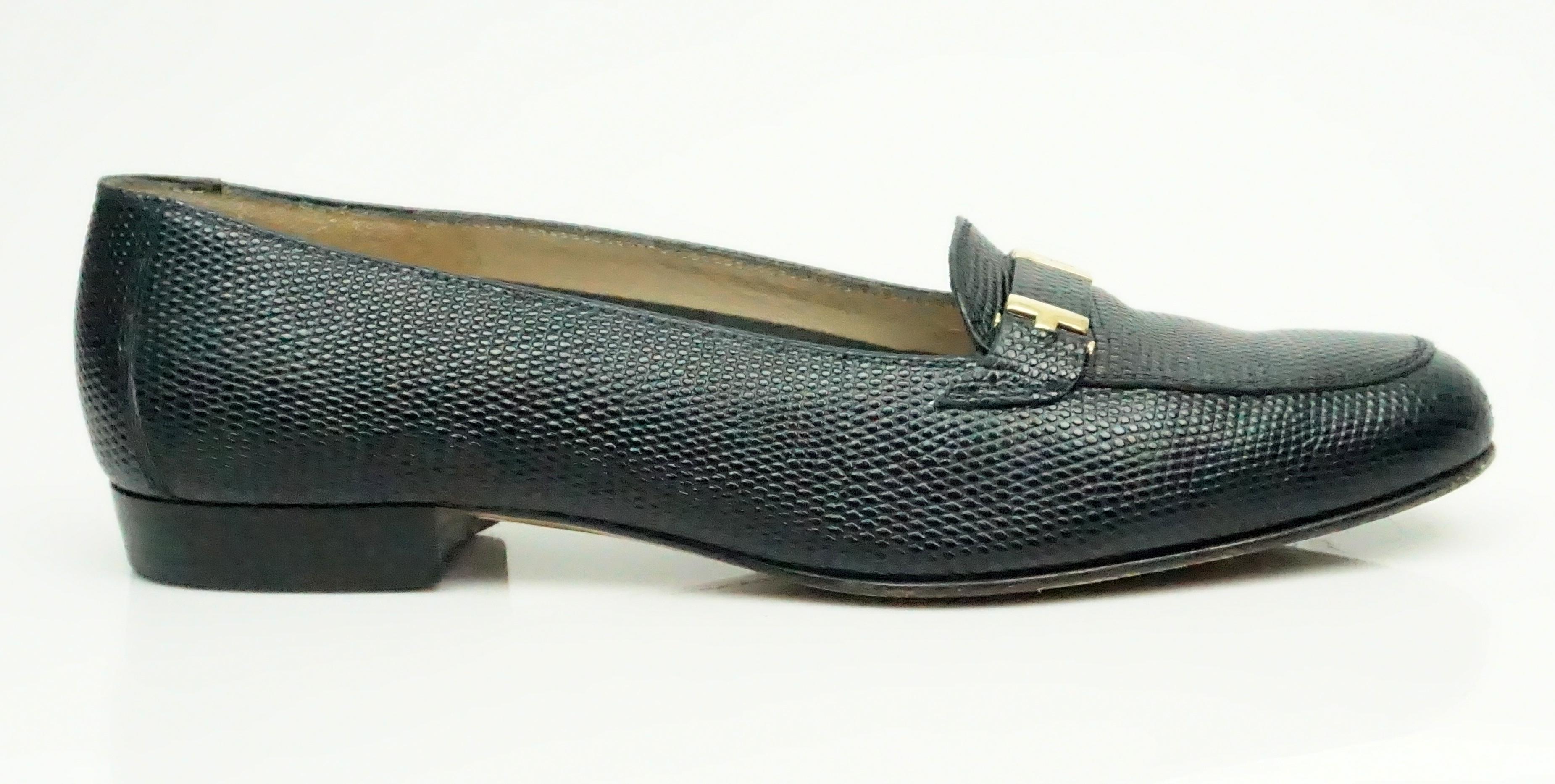 Salvatore Ferragamo Navy Lizard Loafer - 6.5  This beautiful loafers are in good condition. The bottom of the loafer is a bit marked up but the rest of the shoe is in very good condition. There is a simple gold hardware detail on the front of the