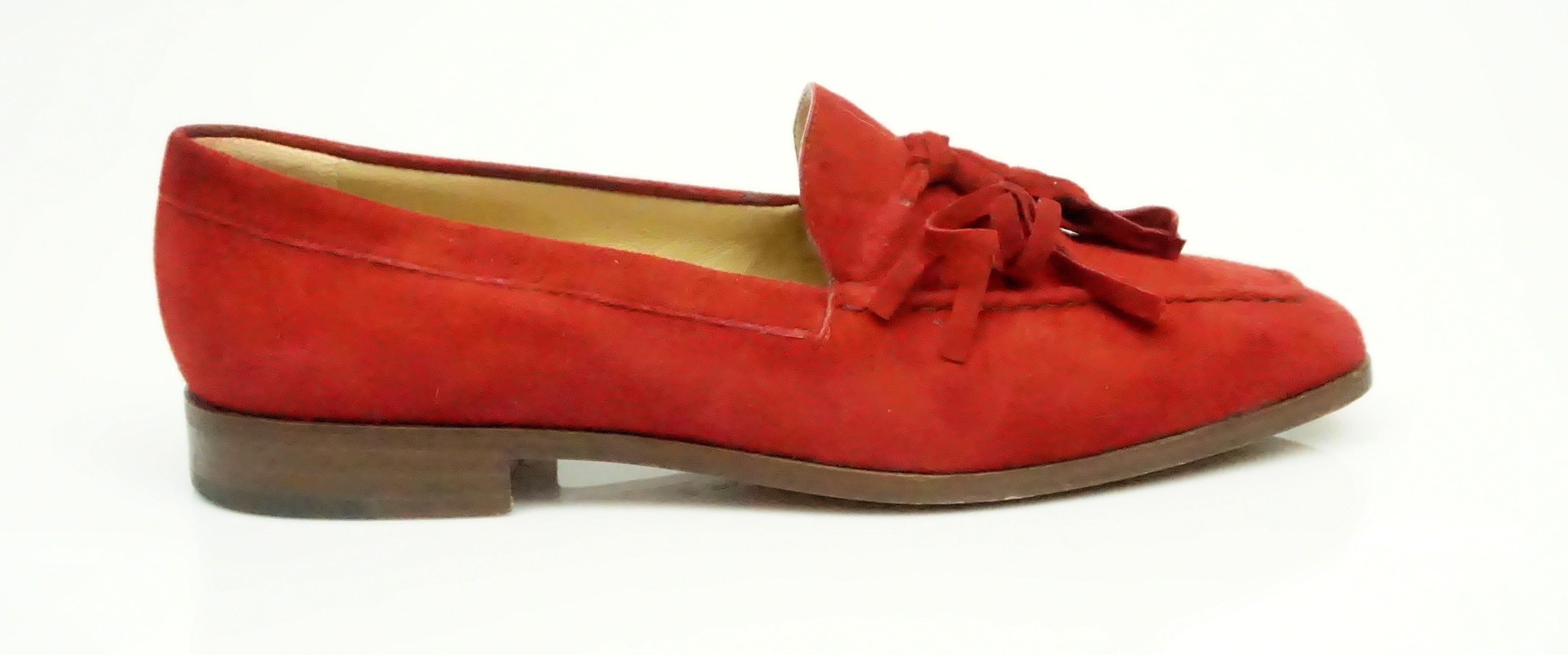 Gucci Vintage Red Suede Tassel Loafer - 6.  This gorgeous suede loafer is in excellent condition. The entire shoe is covered in suede and has a suede tassel detail in the front. There is some wear on the bottom of the shoe but the rest of the shoe
