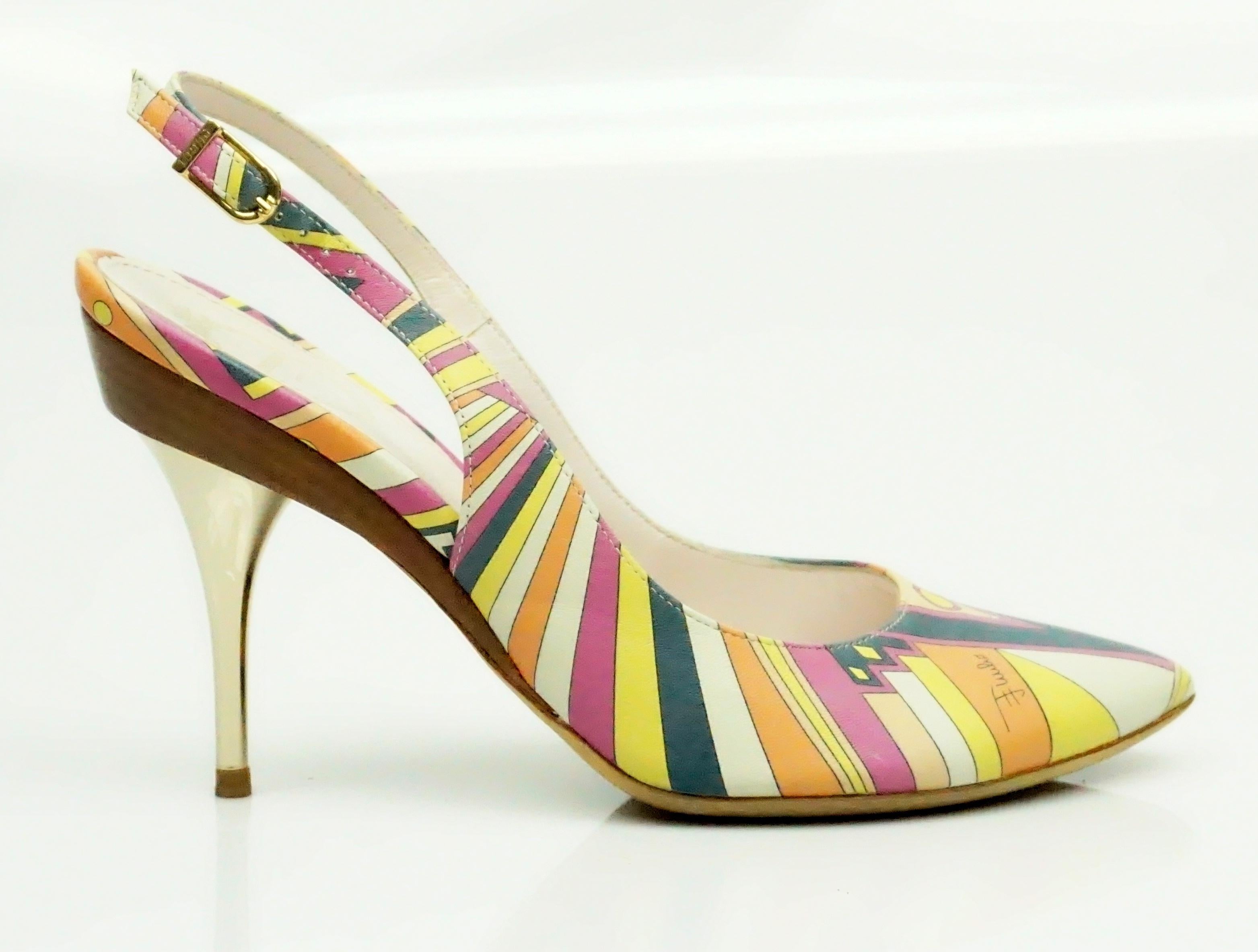 Emilio Pucci Multi Printed Leather Slingbacks - 36  These gorgeous heels are in excellent condition. The heels have a classic Emilio Pucci print on them and the fabric is made out of leather. The heel starts with a wood layer and then becomes a