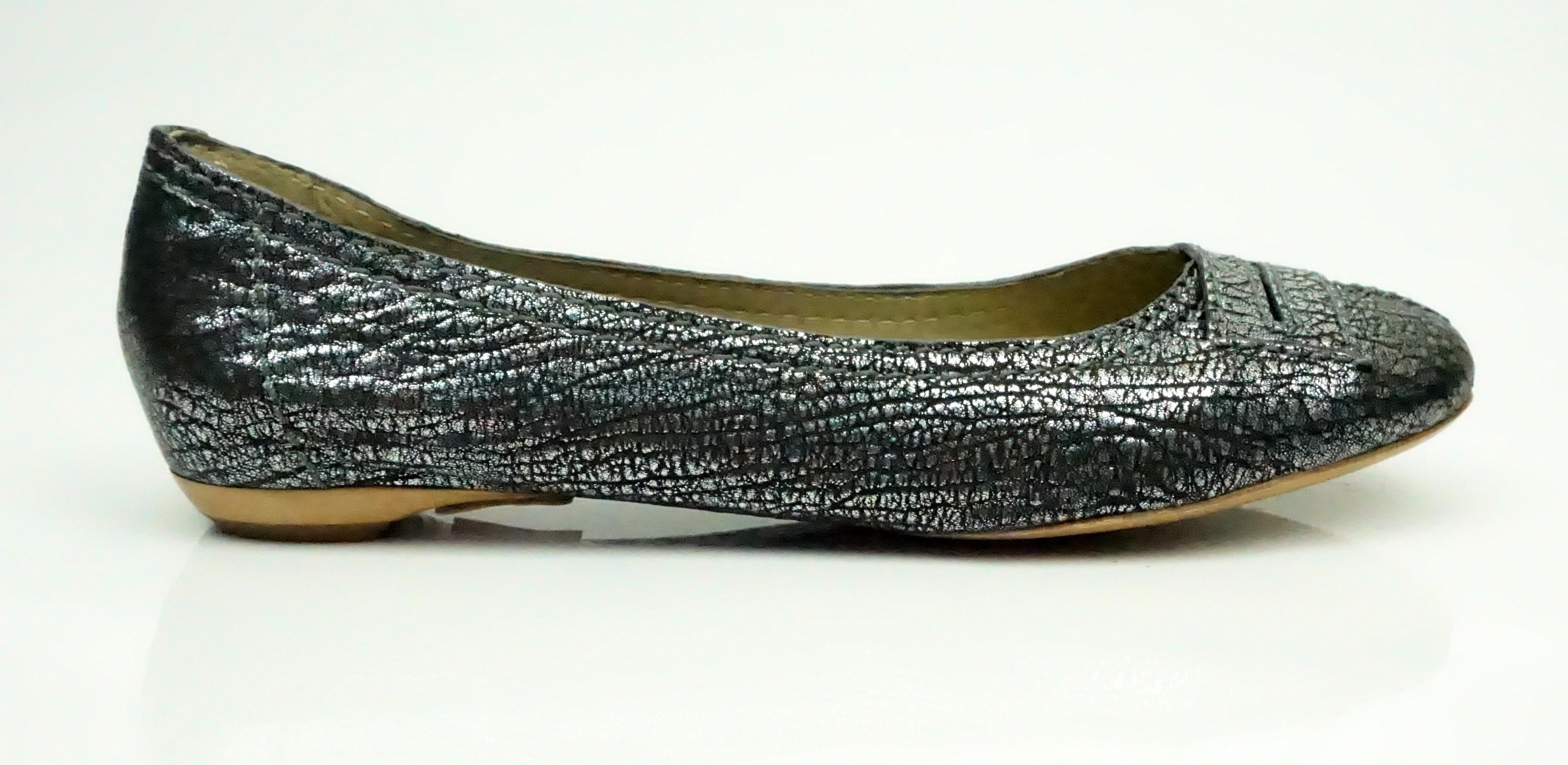 Chloe Gunmetal Metallic Flats - 38.5  These beautiful flats are in excellent condition. They appear to have never been worn before. The fabric of the shoe is thin and has a silver metallic look to it. There is a stitching detail in the front of the