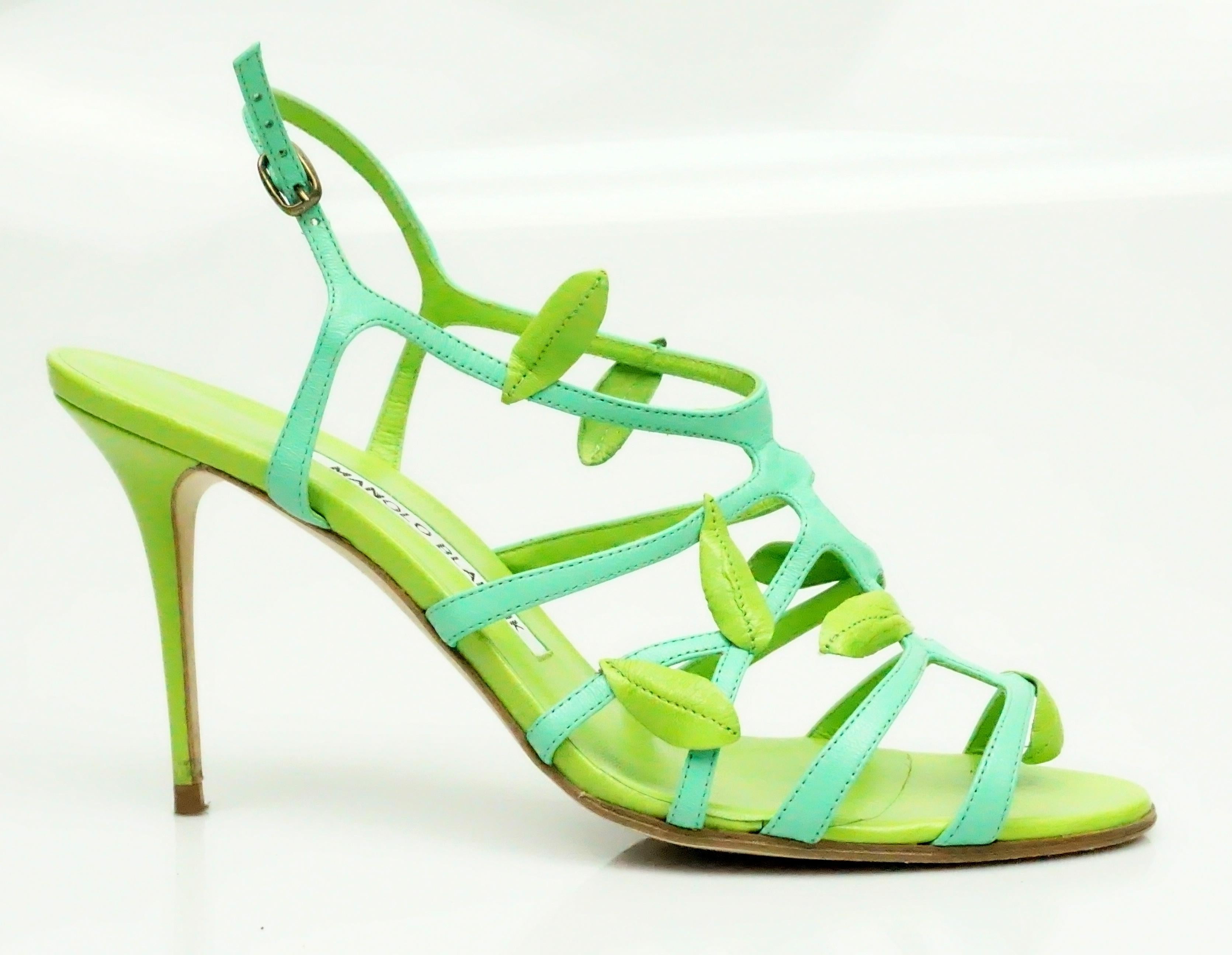 Manolo Blahnik Green Strappy Sandal Heel w/ Leaf Detail - 37  These Beautiful and unique shoes are in excellent condition. They are made of a leather material and are two different colors, green and turquoise. There is a leaf detail throughout the