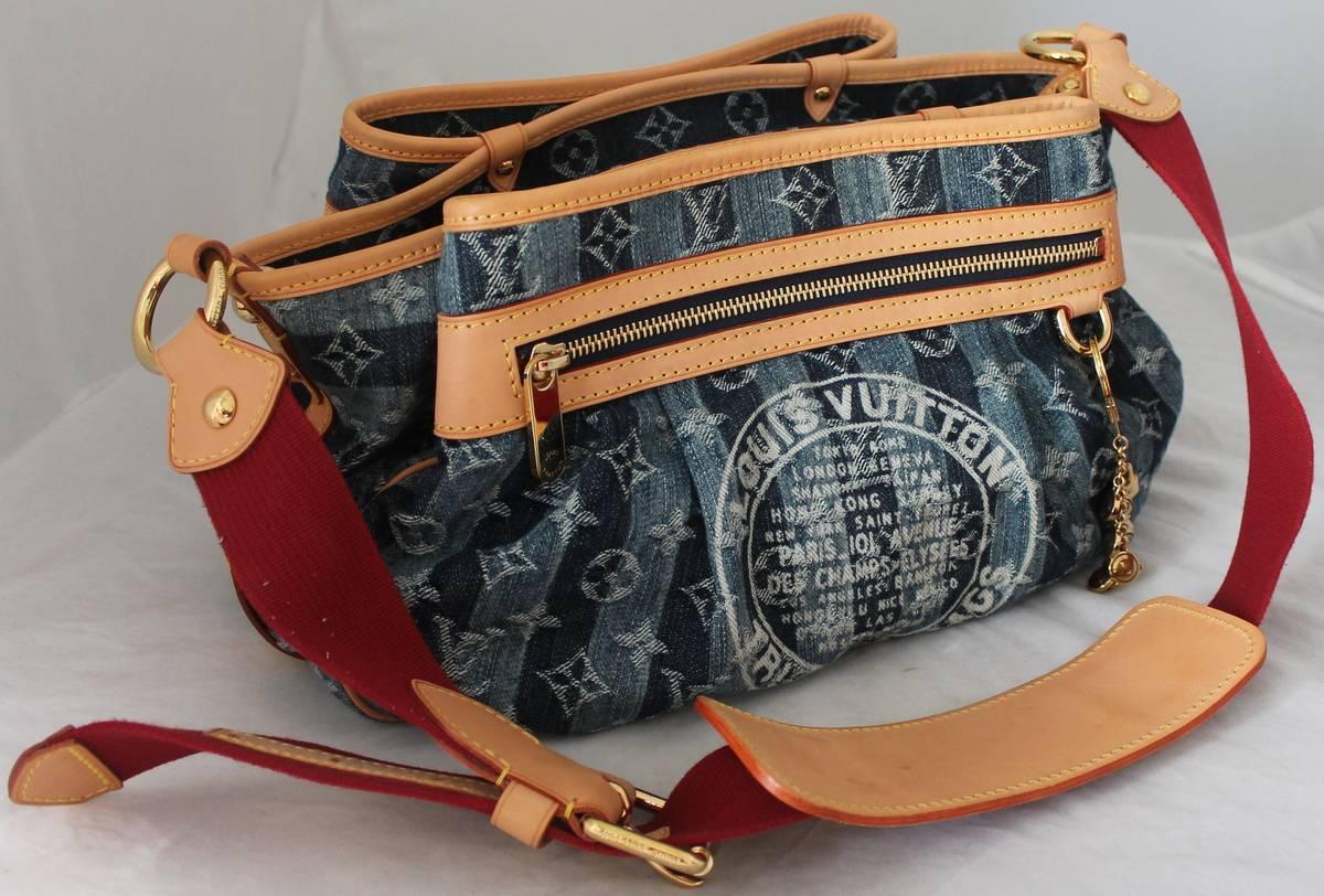 Louis Vuitton Striped Blue Denim Adjustable Shoulder Bag - circa 2006. This bag is in excellent condition with only slight markings on the bottom of the strap. The strap also has red on it and the bag has a hanging charm