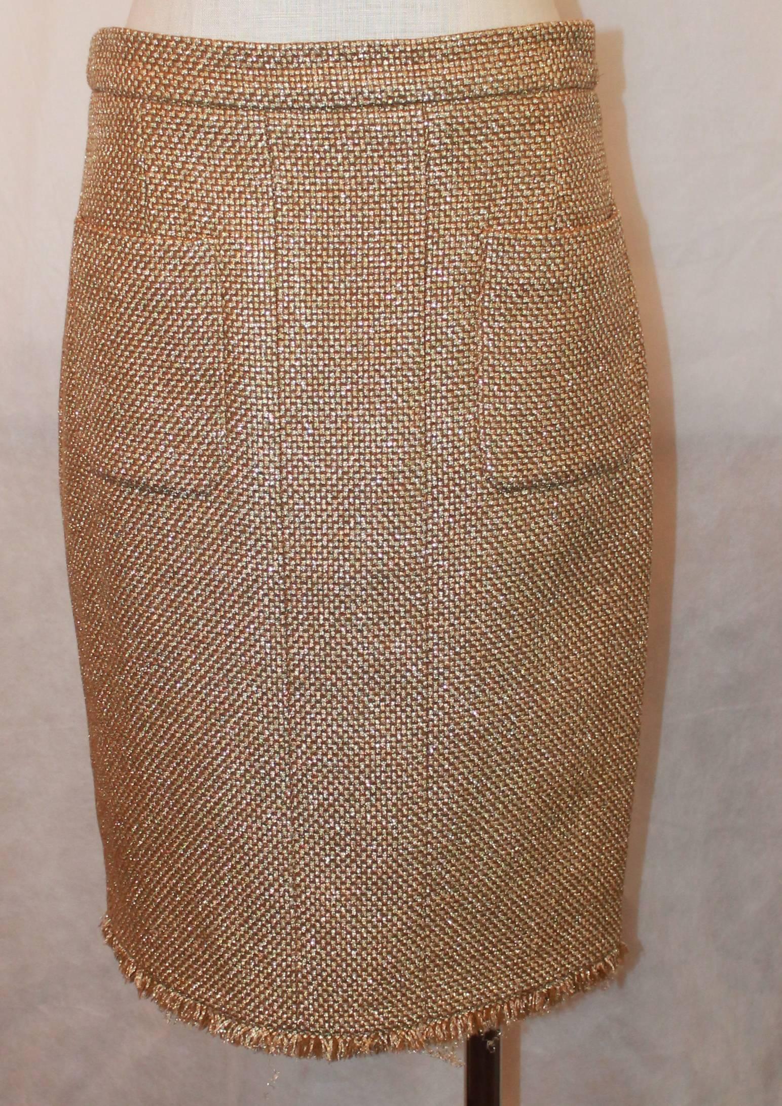 Chanel Metallic Gold Tweed Skirt with Fringe Trim & 2 Pockets - NWT - 40. This skirt is brand new and has all the tags and swatch/button. It has a back zipper. There are 3 buttons on the back bottom with smoky topaz