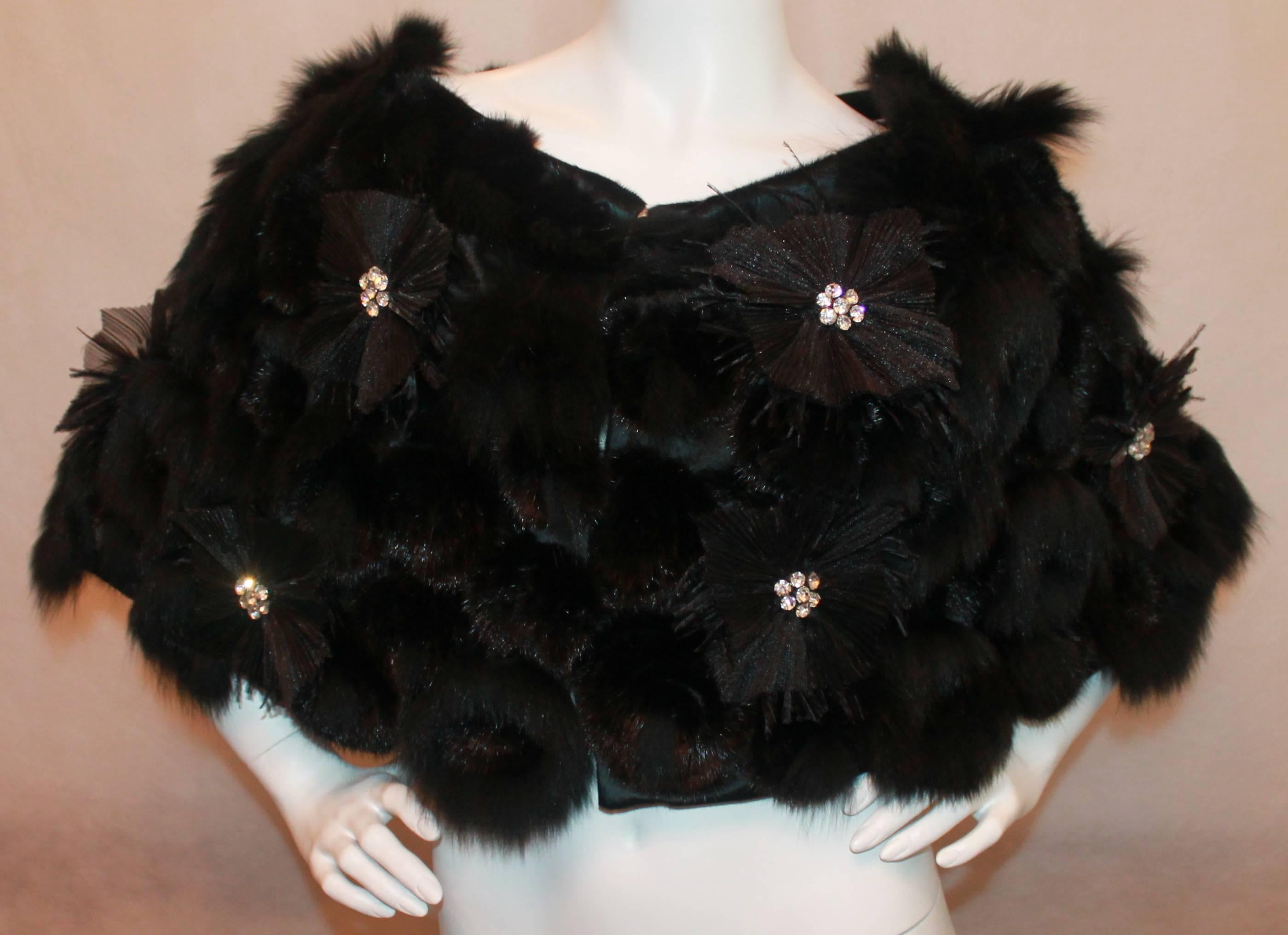 Prabal Gurung Black Mink & Fox floral pattern caplet with Rhinestone detail-M
Inside is fully lined in silk. 3 hook closures in front so it can be worn somewhat open or fully closed. This item is in excellent condition.

Measurements:
Length