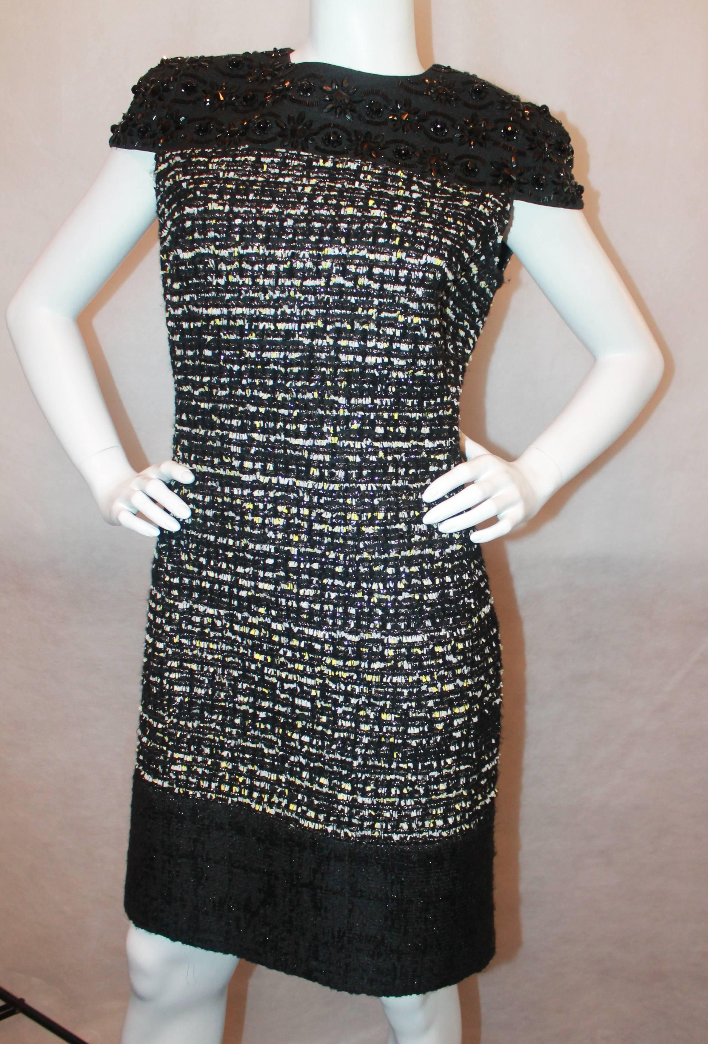 Giambattista Valli Black Stone and Muli Tweed Dress - 10 Top portion of dress is a black silk with cap sleeve and heavy stone work throughout. The main portion of the dress is a black, white, yellow and silver metallic tweed, with a bottom black